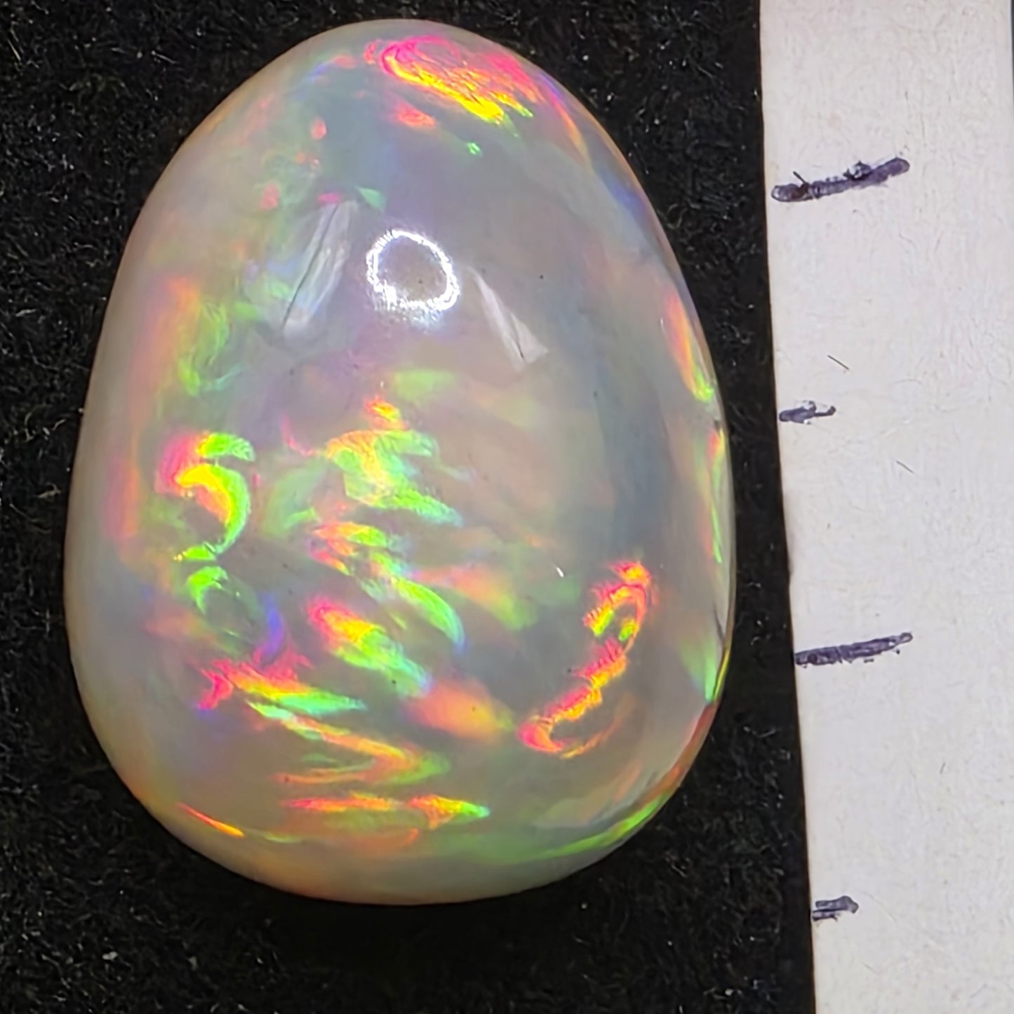 Black Opal special Ethiopian Welo, 11.5 ct pear polished, natural, intense Play-of-Colour