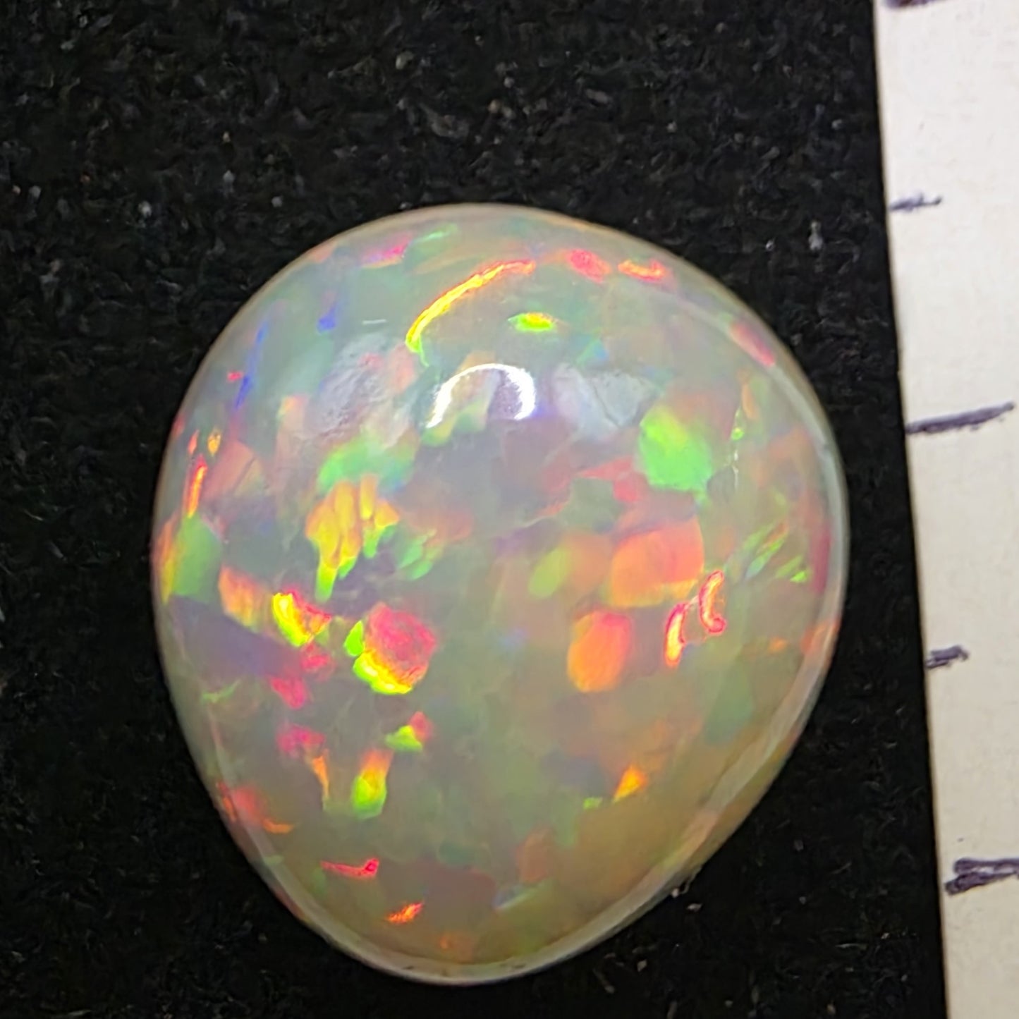 White Opal special Ethiopian Welo, 8.2 ct pear polished, natural, intense Play-of-Colour