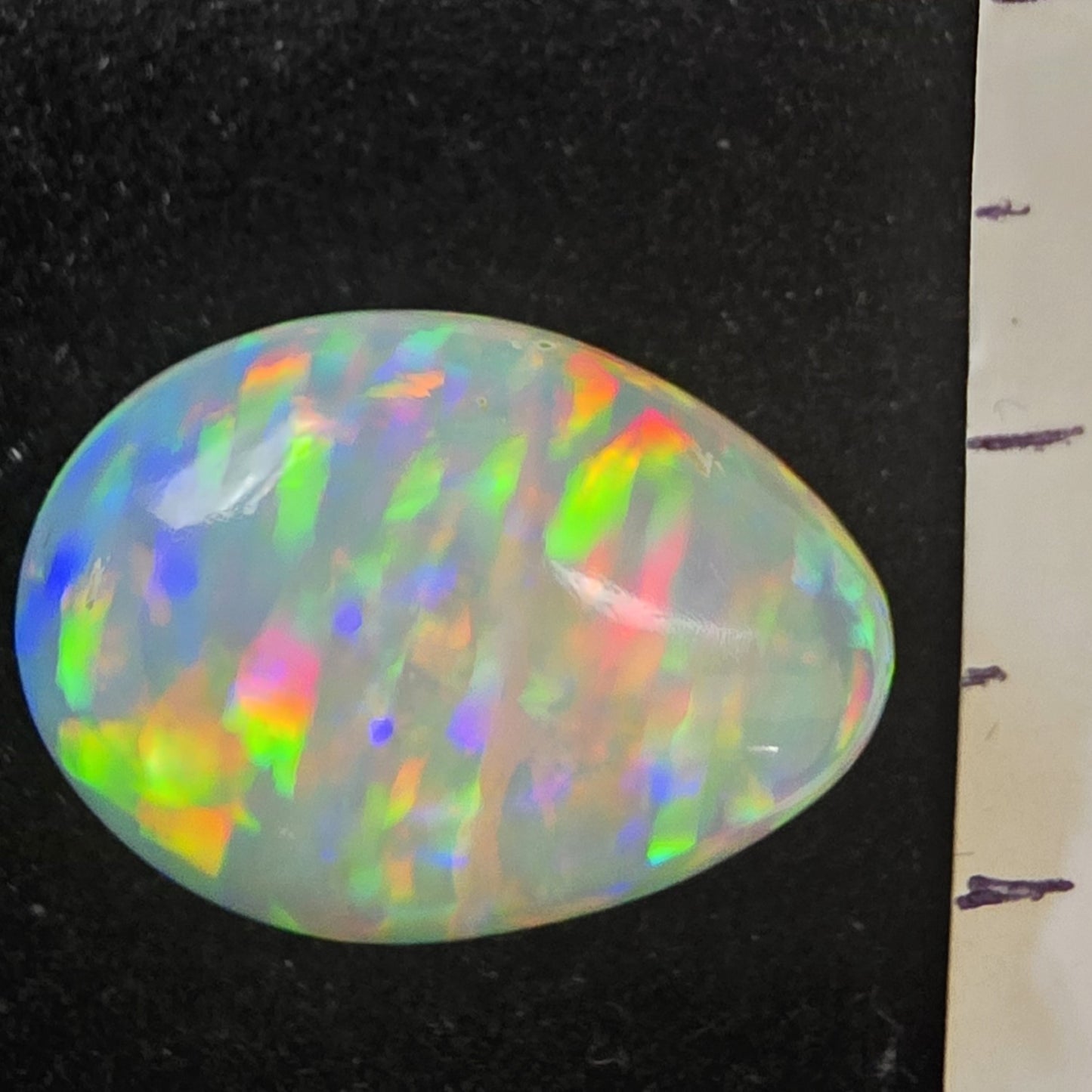 White Opal special Ethiopian Welo, 8.5 ct pear polished, natural, intense Play-of-Colour