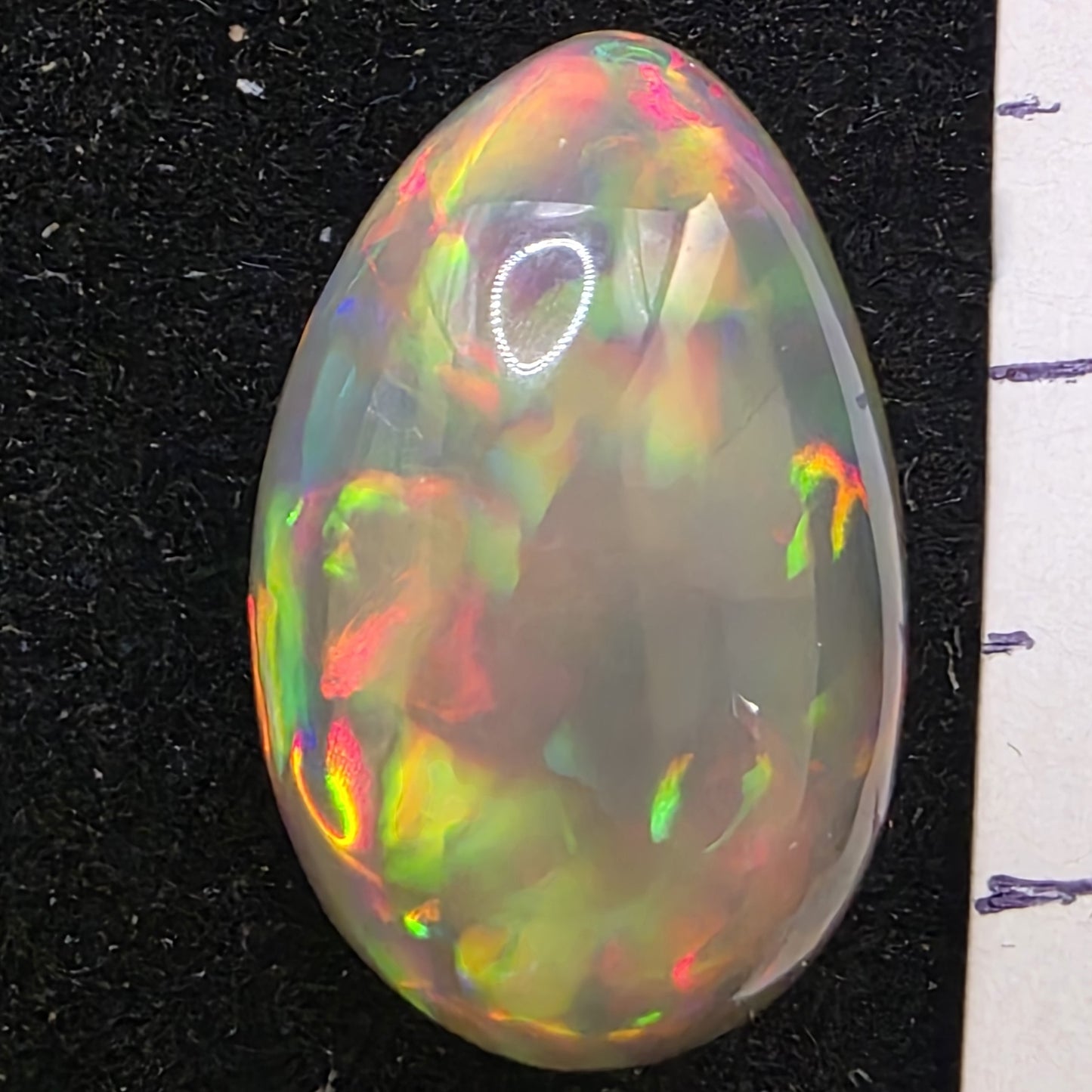 Black Opal special Ethiopian Welo, 9.45 ct pear polished, natural, intense Play-of-Colour