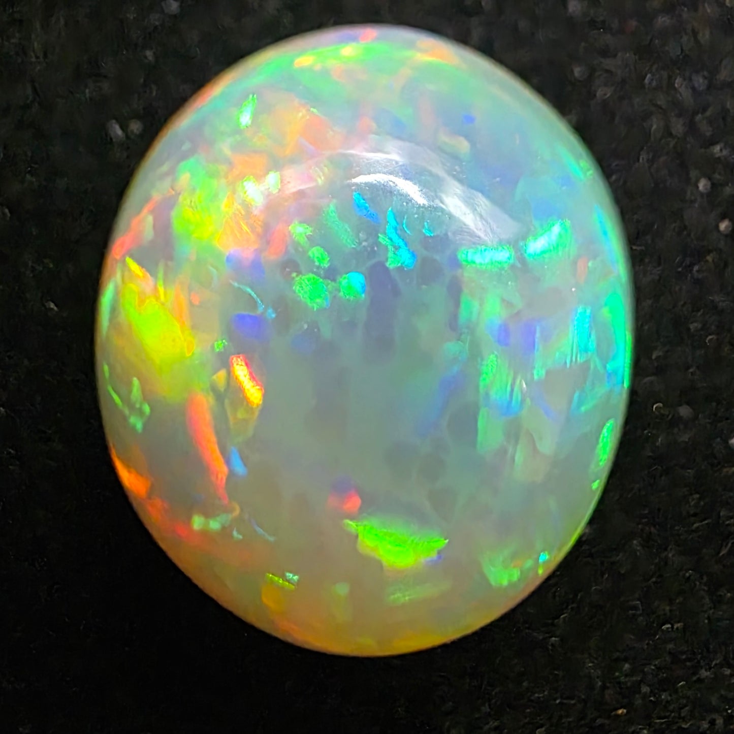 White Opal special Ethiopian Welo, 8.9 ct oval polished, natural, intense Play-of-Colour