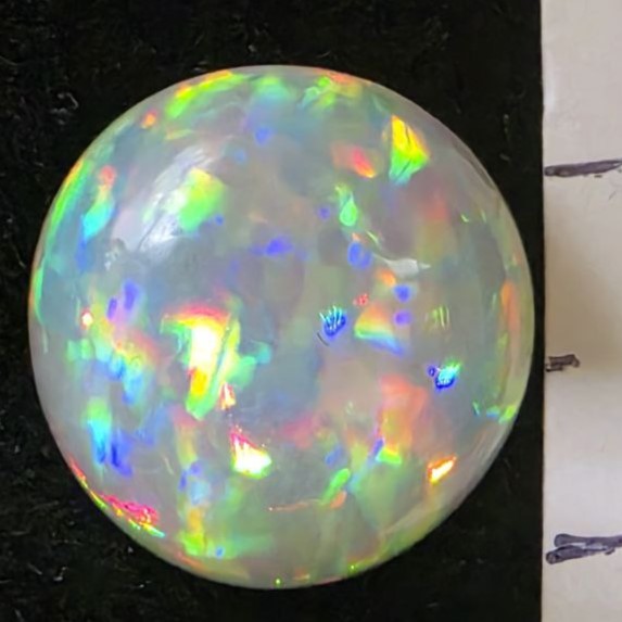 Black Opal special Ethiopian Welo, 5 ct round polished, natural, intense Play-of-Colour