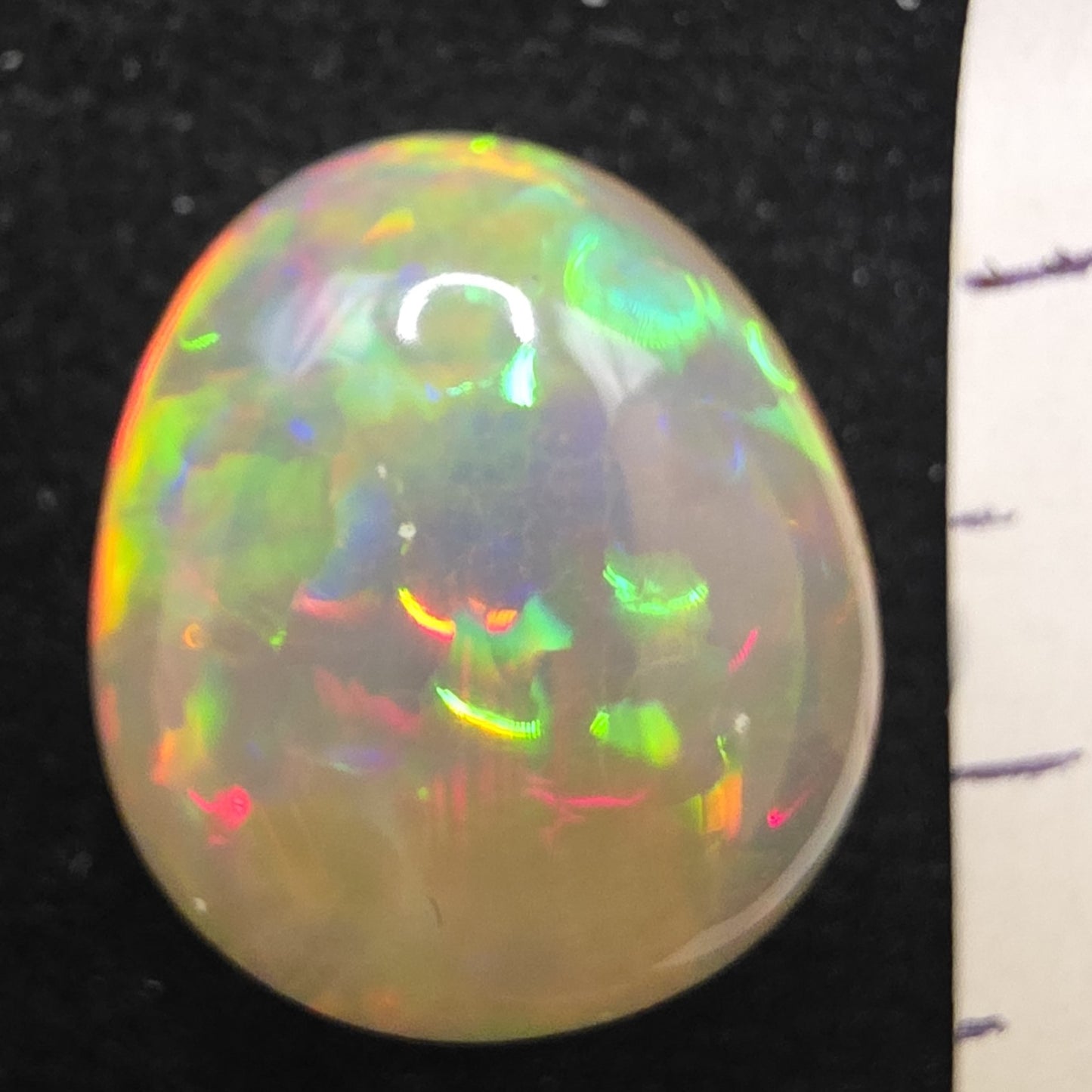 White Opal special Ethiopian Welo, 9.3 ct pear polished, natural, intense Play-of-Colour