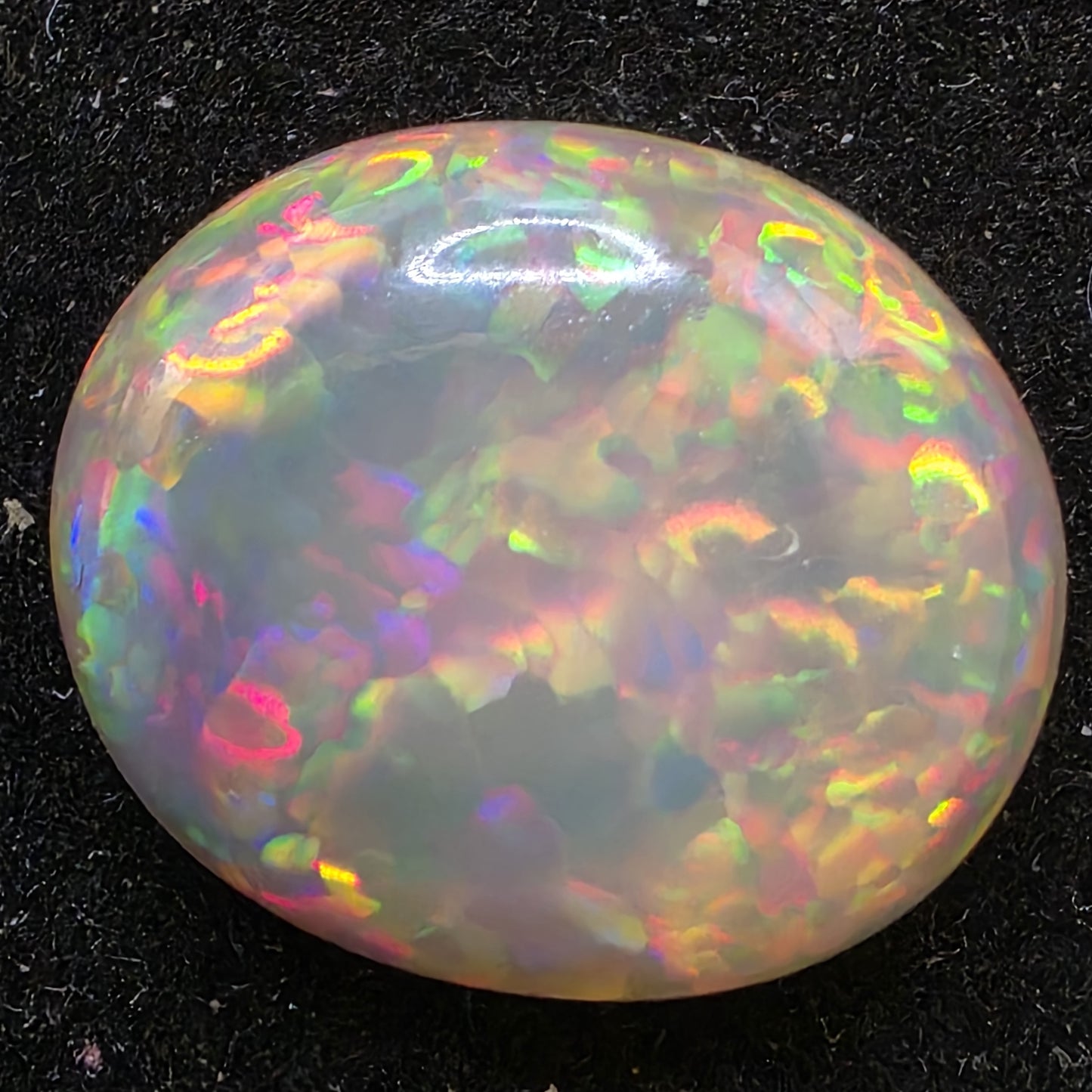 Black Opal special Ethiopian Welo, 6.65 ct oval polished, natural, intense Play-of-Colour