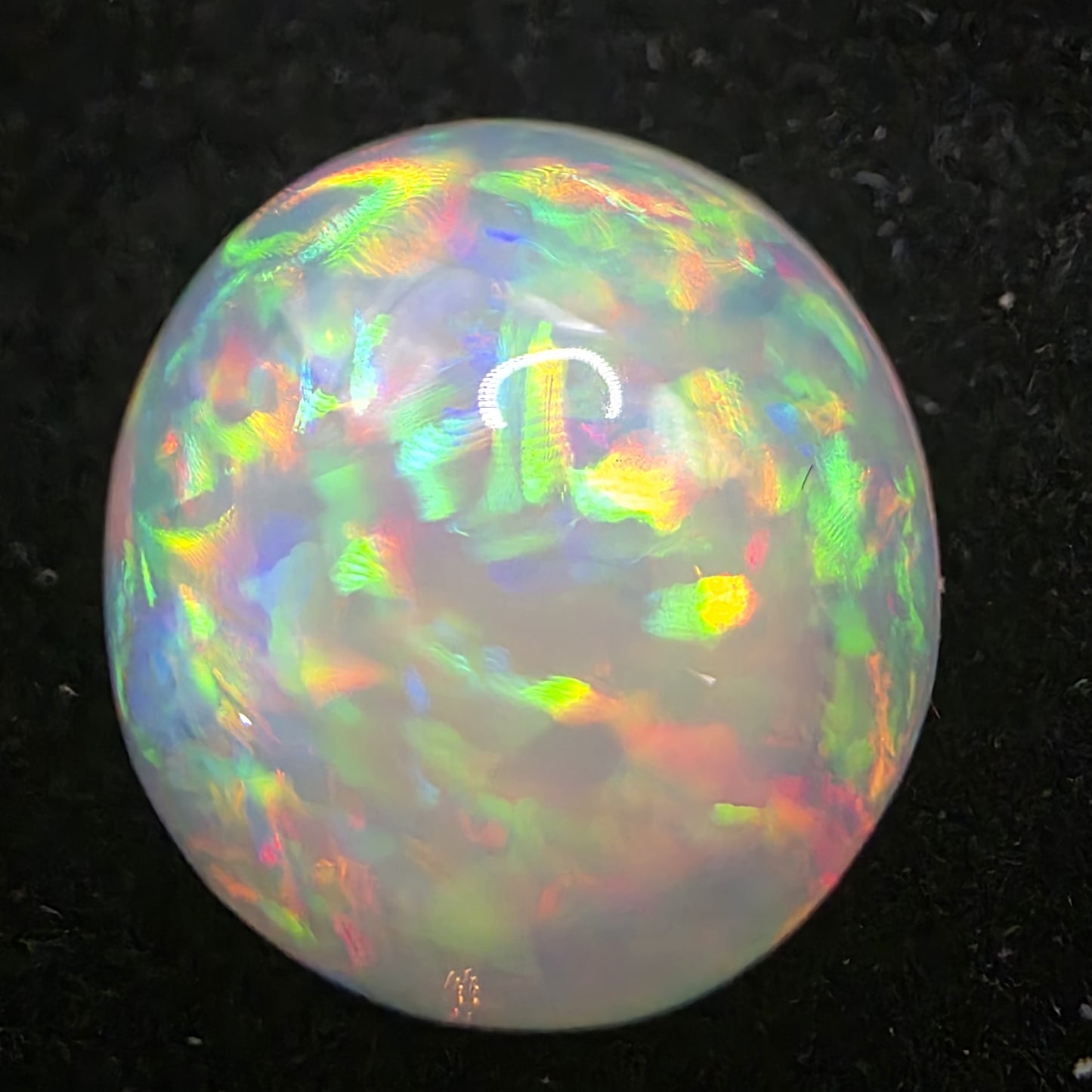 White Opal special Ethiopian Welo, 11.2 ct round polished, natural, intense Play-of-Colour