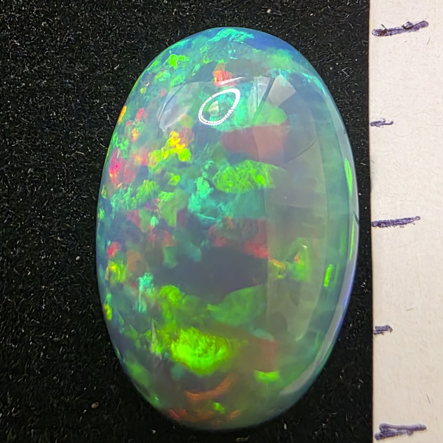 Honeycomb Black Opal special Ethiopian Welo, 8.05 ct oval polished, natural, intense Play-of-Colour