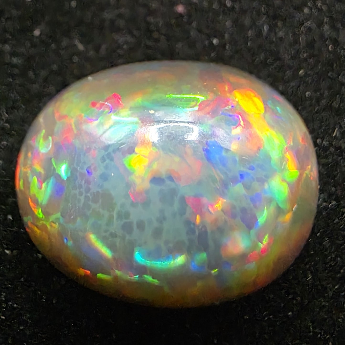 Black Opal special Ethiopian Welo, 9.55 ct oval polished, natural, intense Play-of-Colour