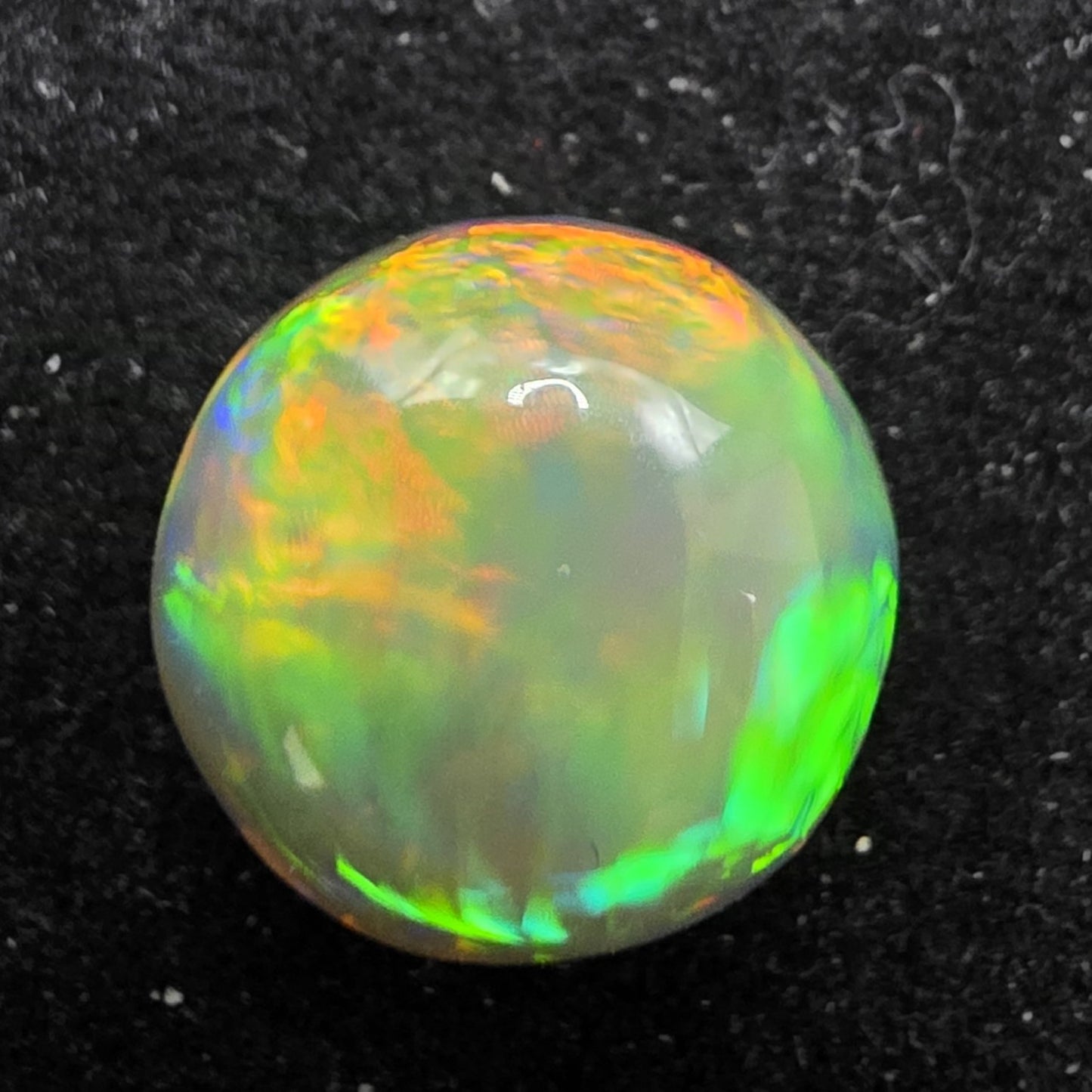 Crystal Opal special Ethiopian Welo, 5.6 ct round polished, natural, intense Play-of-Colour