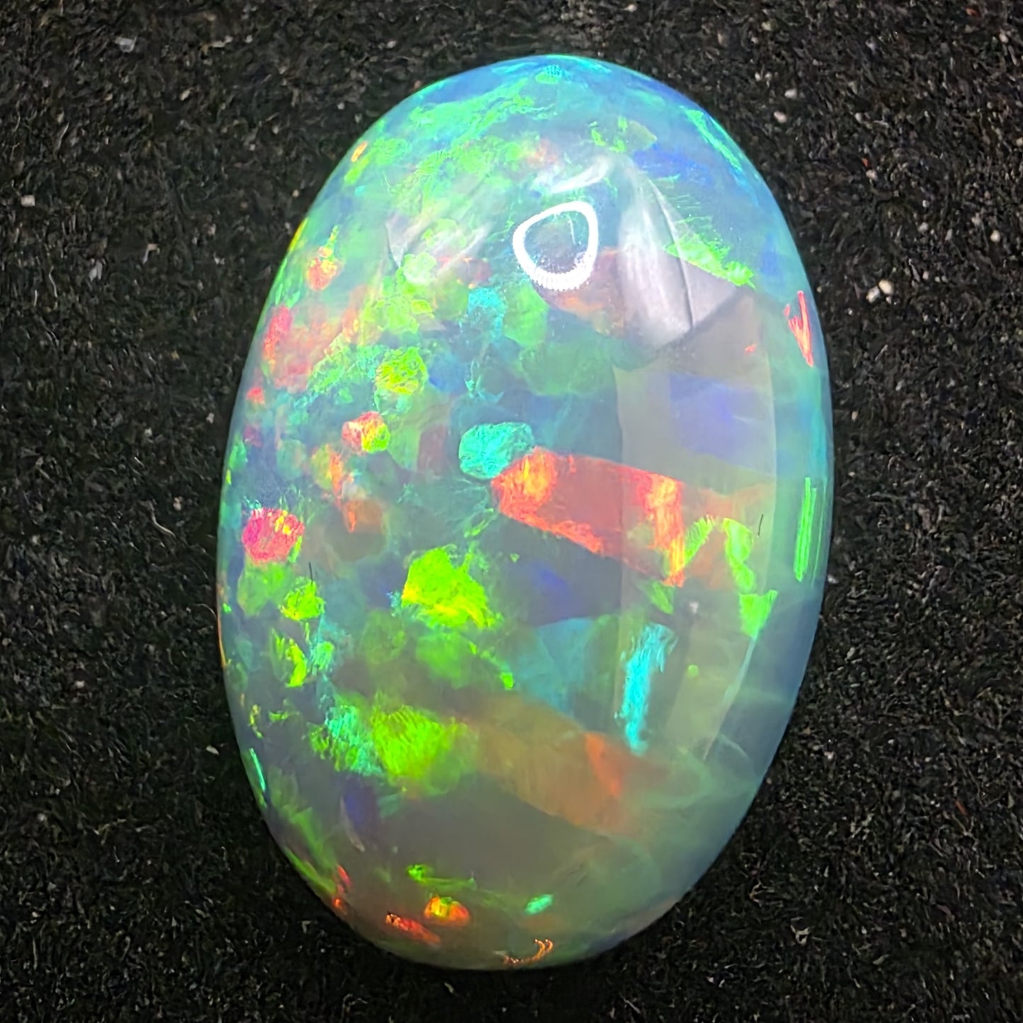 Honeycomb Black Opal special Ethiopian Welo, 8.05 ct oval polished, natural, intense Play-of-Colour