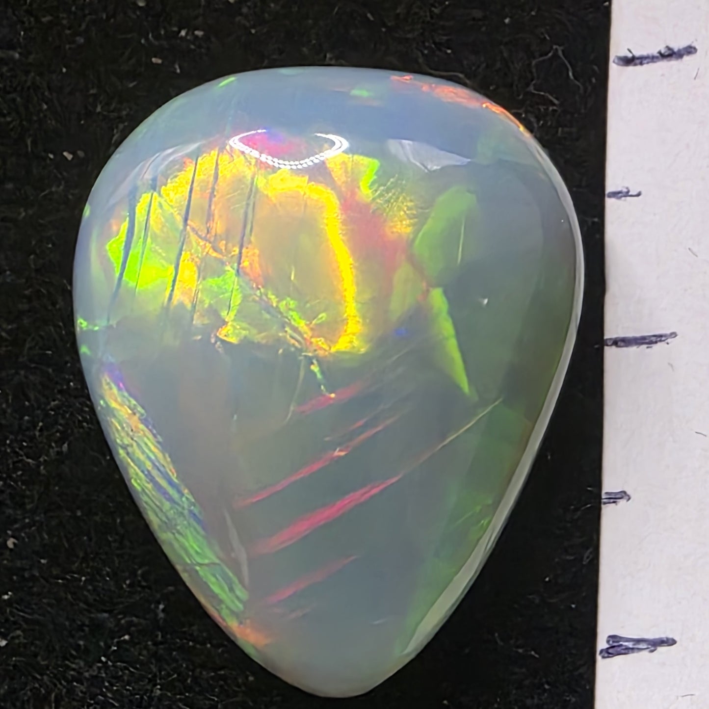 Artsy Black Opal special Ethiopian Welo, 13.85 ct pear polished, natural, intense Play-of-Colour