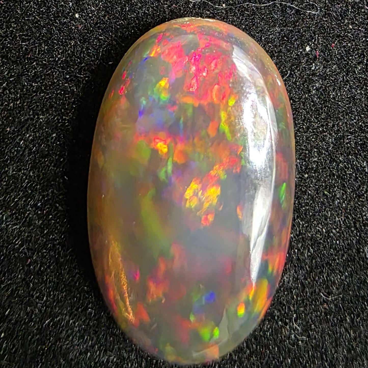 Black Opal special Ethiopian Welo, 4.55 ct oval polished, natural, intense Play-of-Colour