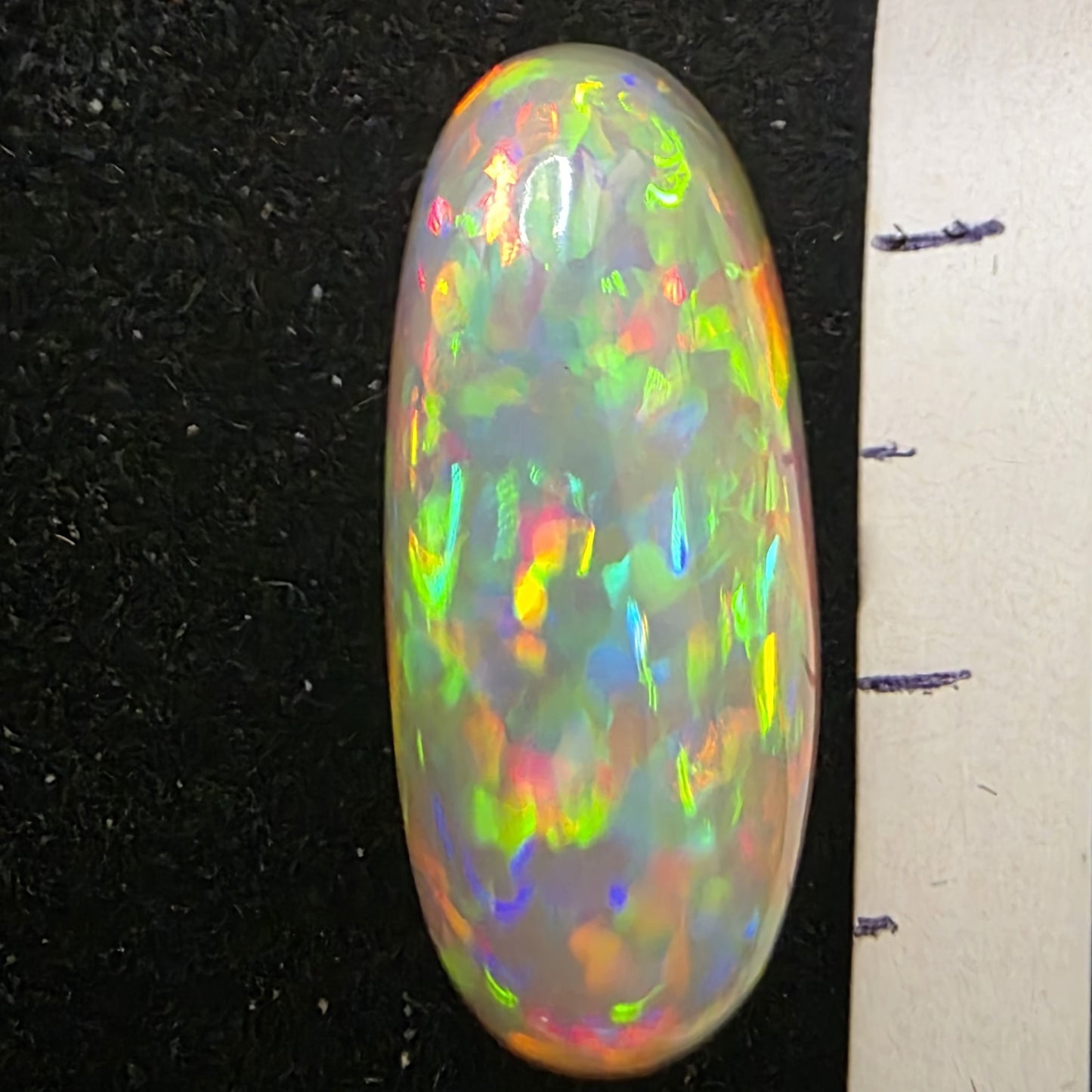 Black Opal special Ethiopian Welo, 6.85 ct oval polished, natural, intense Play-of-Colour