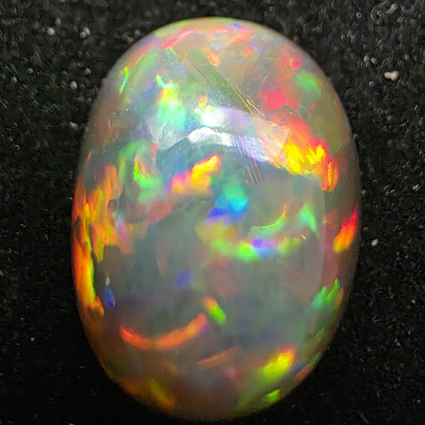 Black Opal special Ethiopian Welo, 9.55 ct oval polished, natural, intense Play-of-Colour
