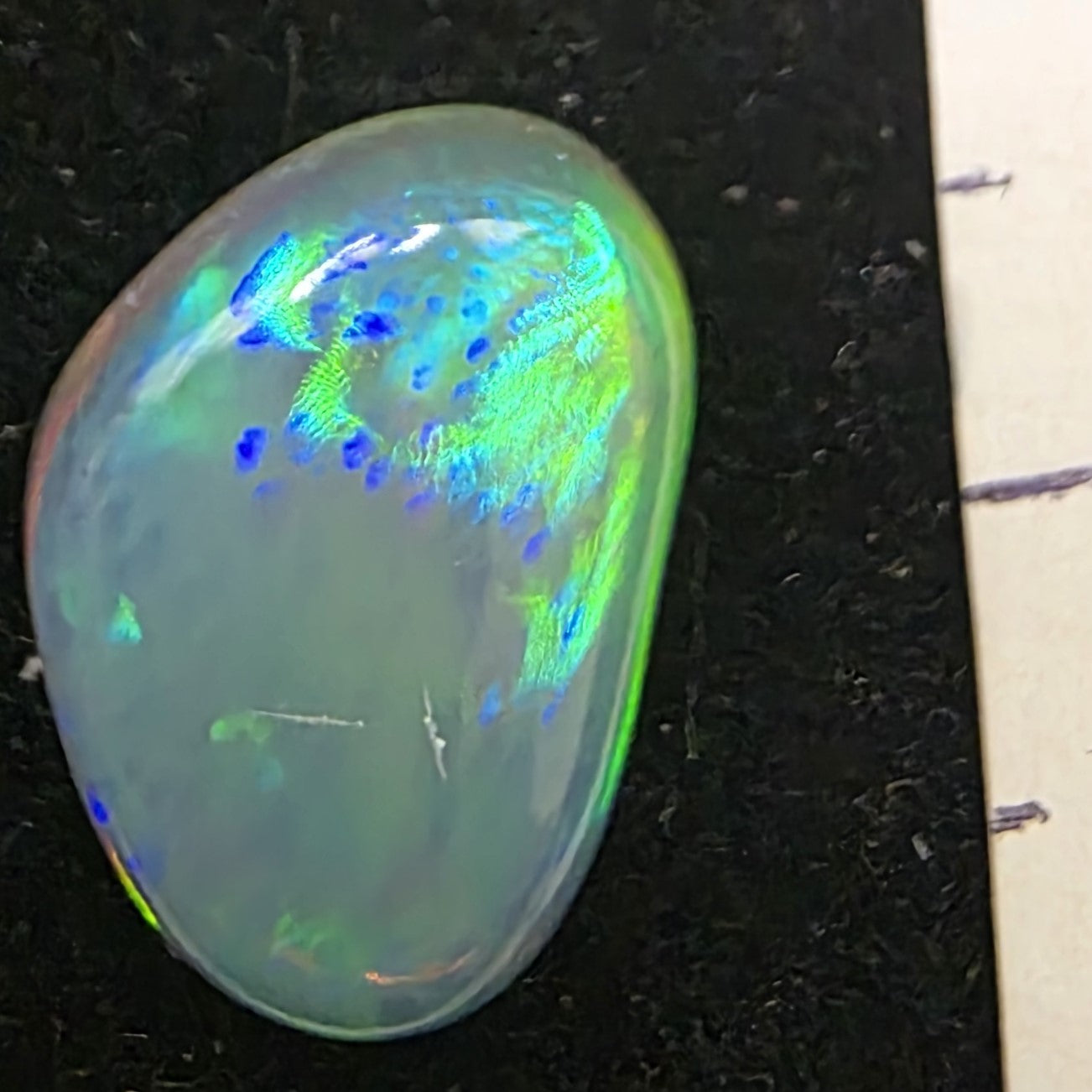 Black Opal special Ethiopian Welo, 4.25 ct freeform polished, natural, intense Play-of-Colour