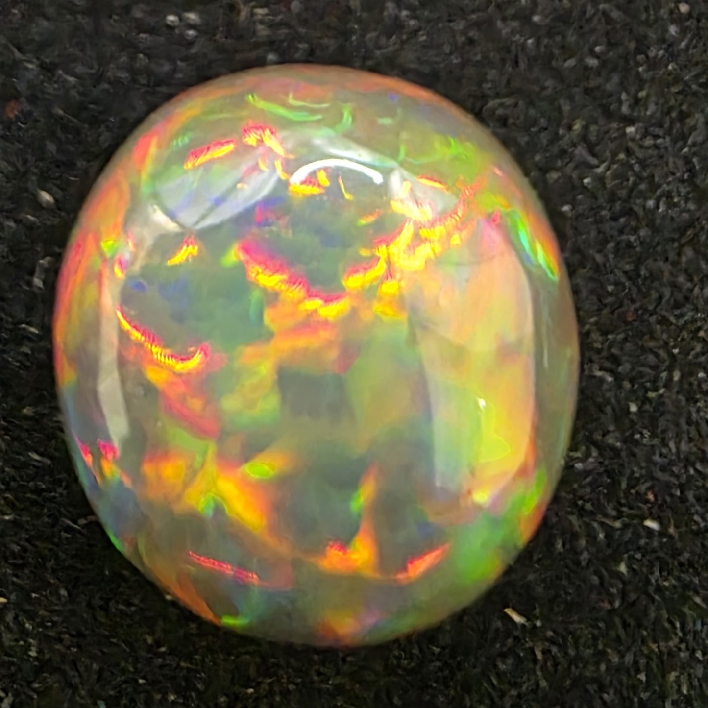 Black Opal special Ethiopian Welo, 4.4 ct freeform polished, natural, intense Play-of-Colour