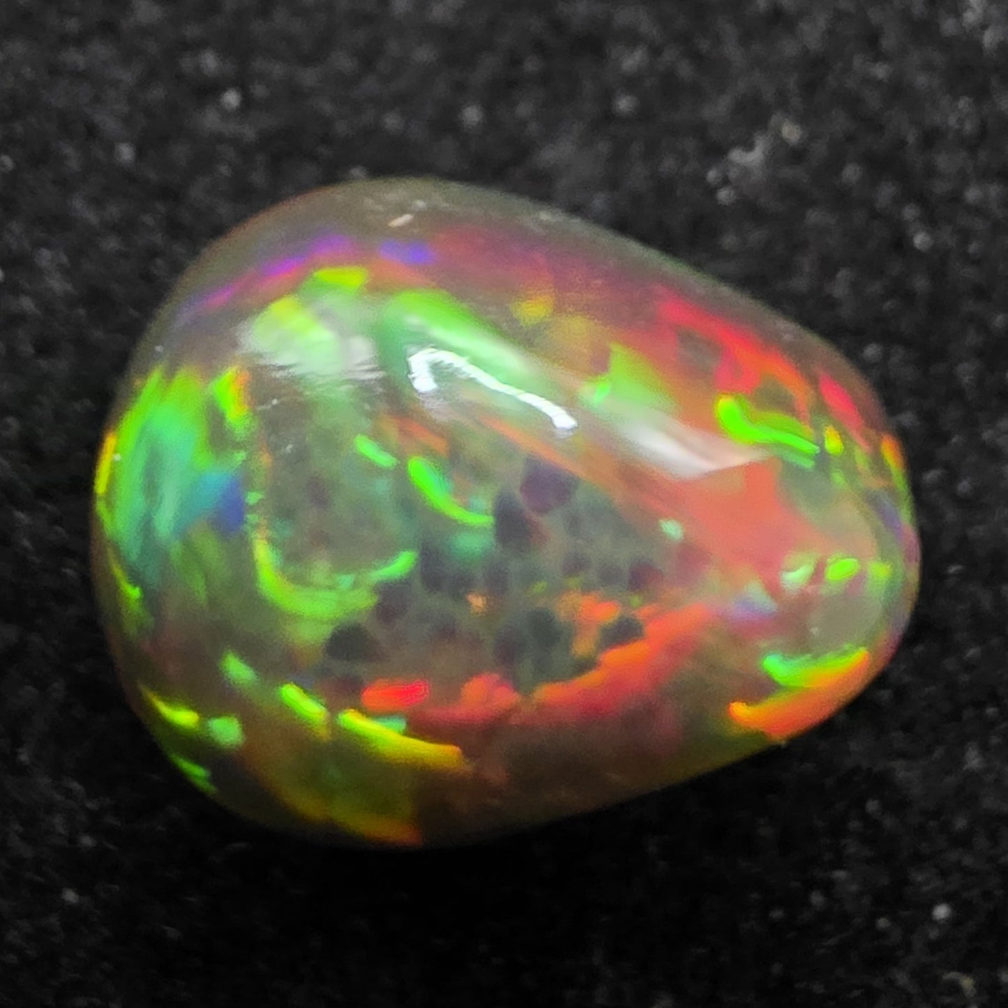 Black Opal special Ethiopian Welo, 5 ct pear polished, natural, intense Play-of-Colour