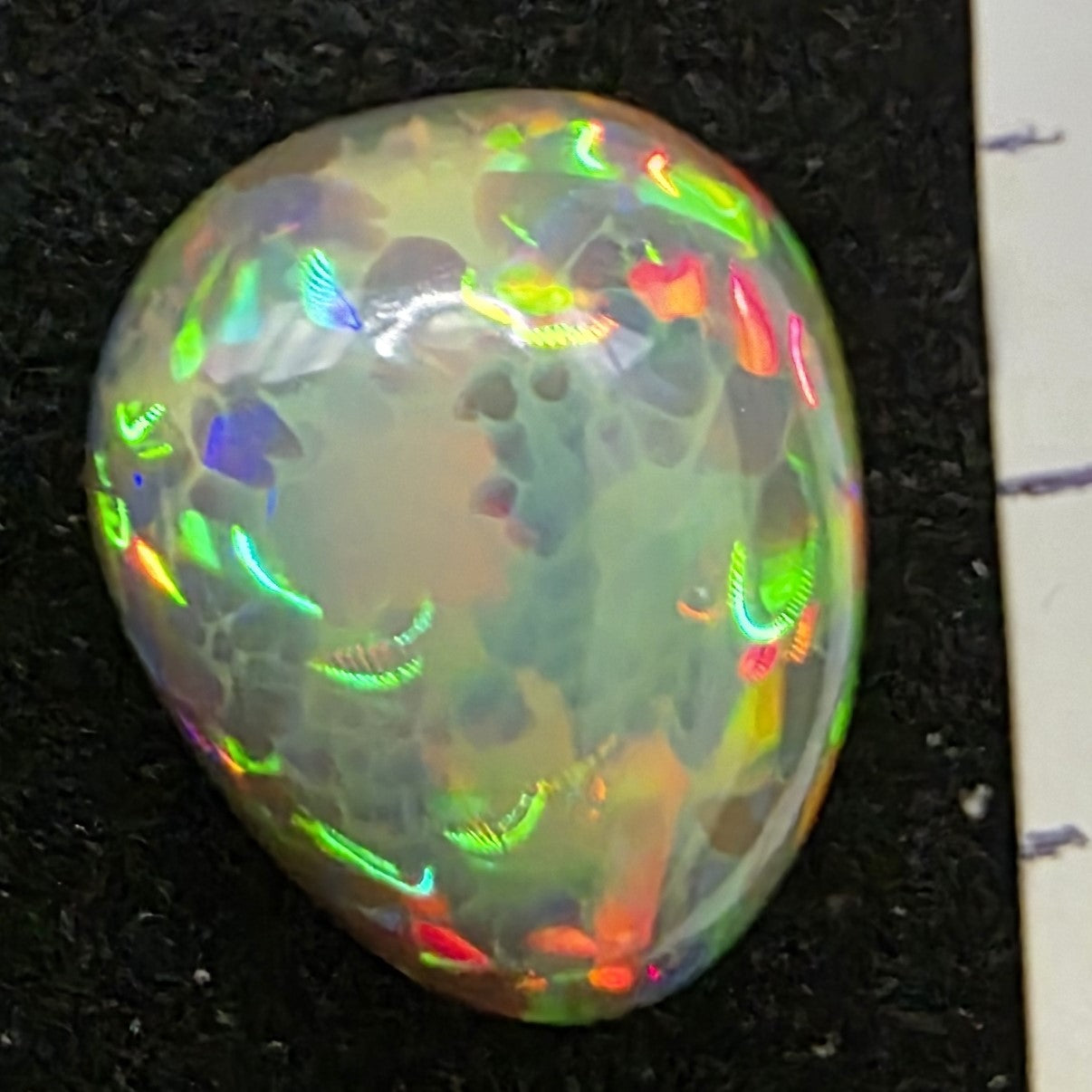 Black Opal special Ethiopian Welo, 3.7 ct pear polished, natural, intense Play-of-Colour