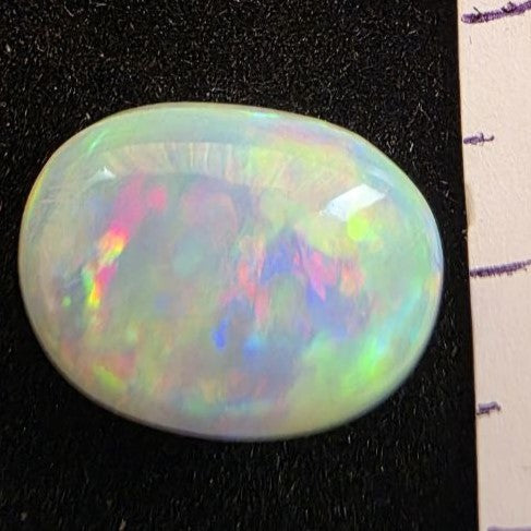 White Opal special Ethiopian Welo, 5.4 ct oval polished, natural, intense Play-of-Colour