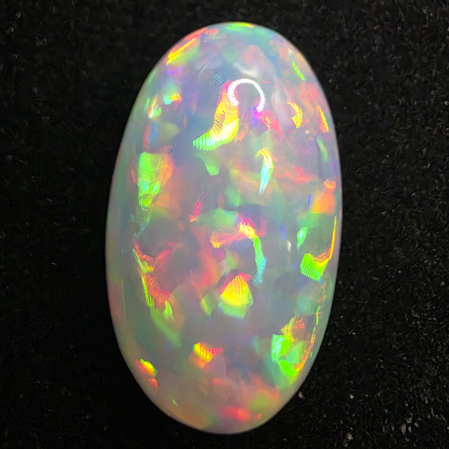White Opal special Ethiopian Welo, 13.05 ct oval polished, natural, intense Play-of-Colour