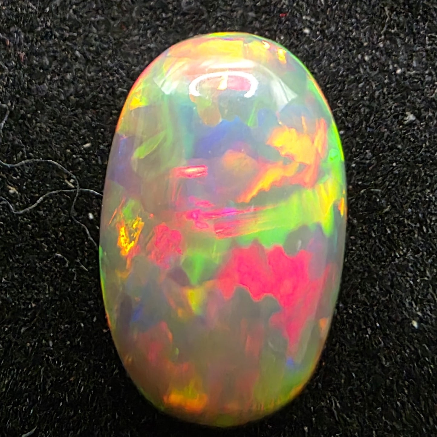 Black Opal special Ethiopian Welo, 2.4 ct oval polished, natural, intense Play-of-Colour