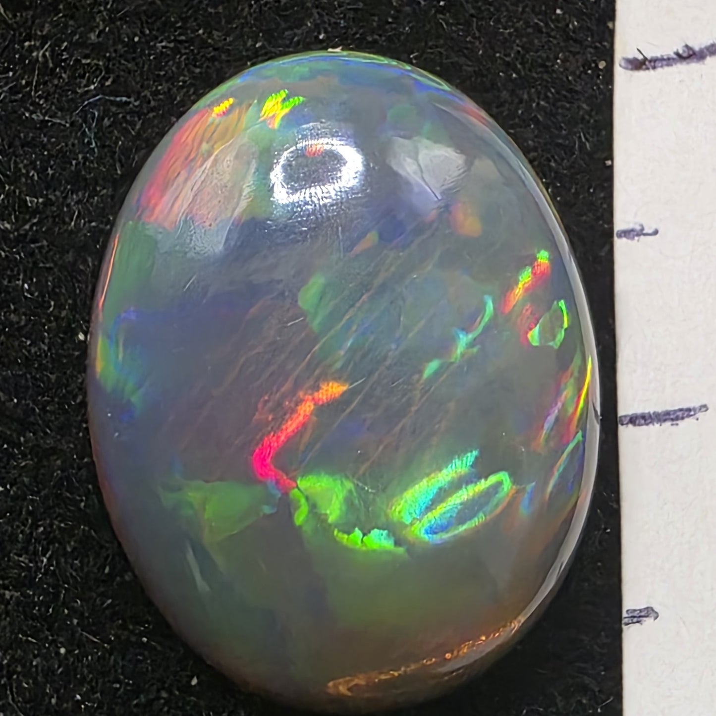 Black Opal special Ethiopian Welo, 7.45 ct oval polished, natural, intense Play-of-Colour