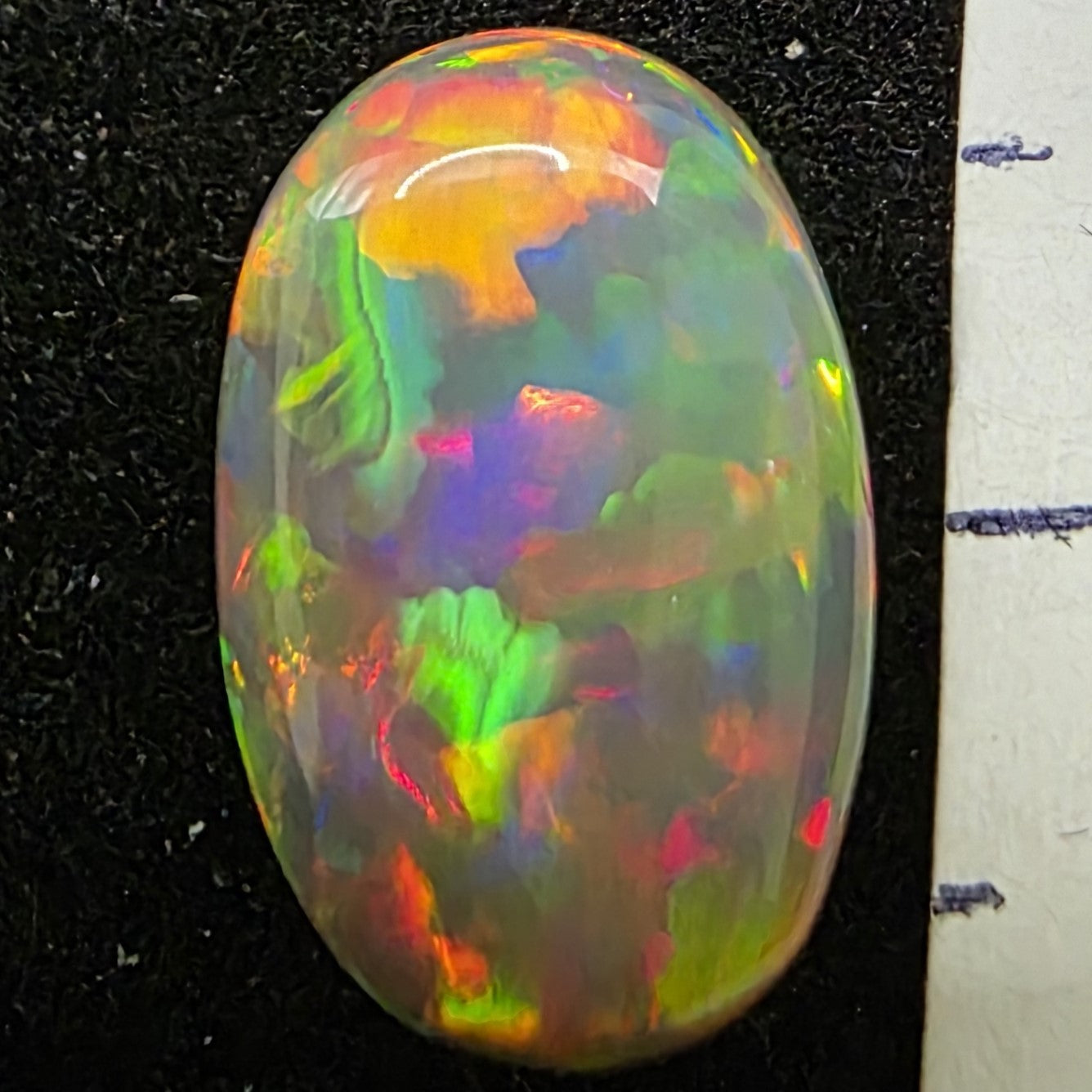 Black Opal special Ethiopian Welo, 2.4 ct oval polished, natural, intense Play-of-Colour