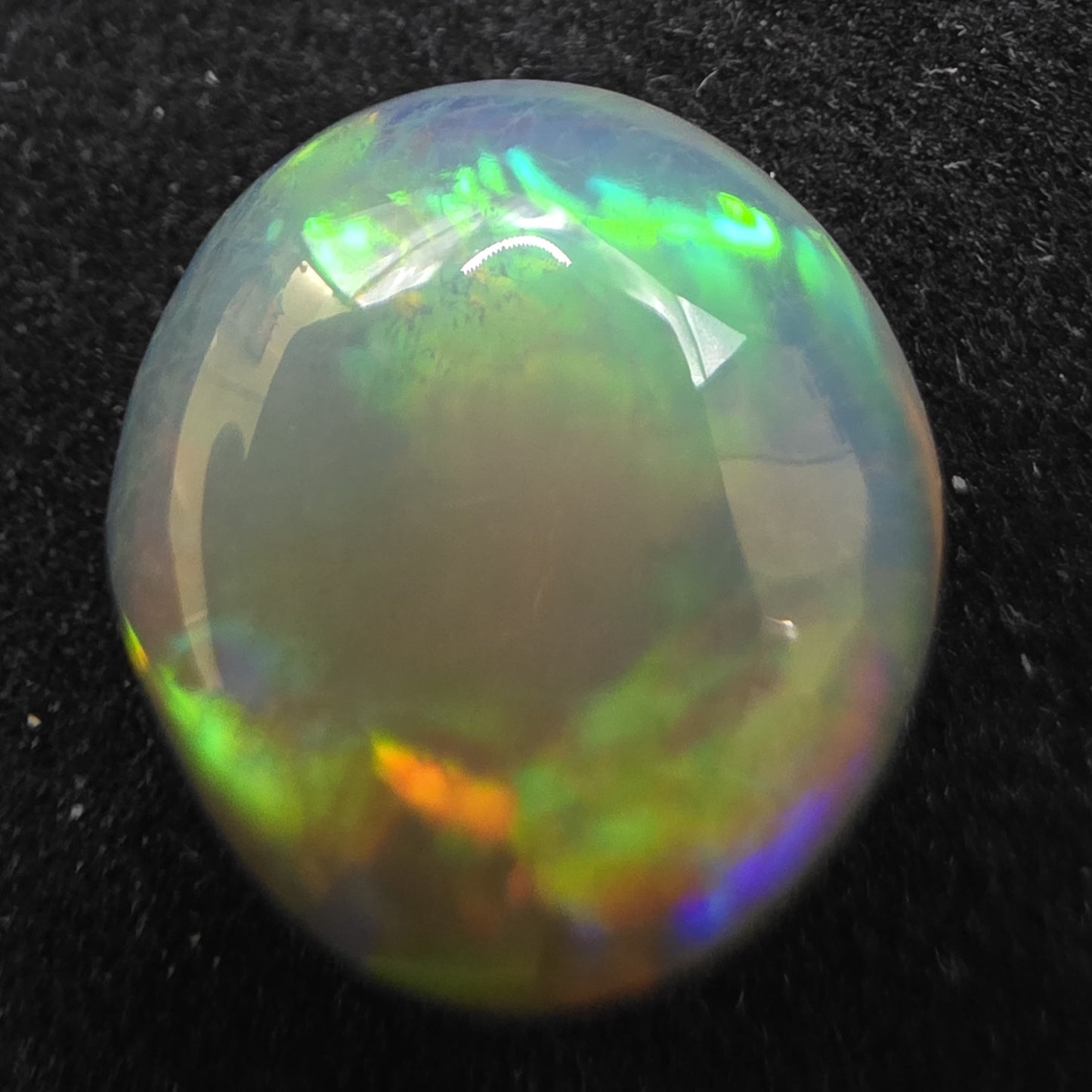 Black Opal special Ethiopian Welo, 5.75 ct round polished, natural, intense Play-of-Colour