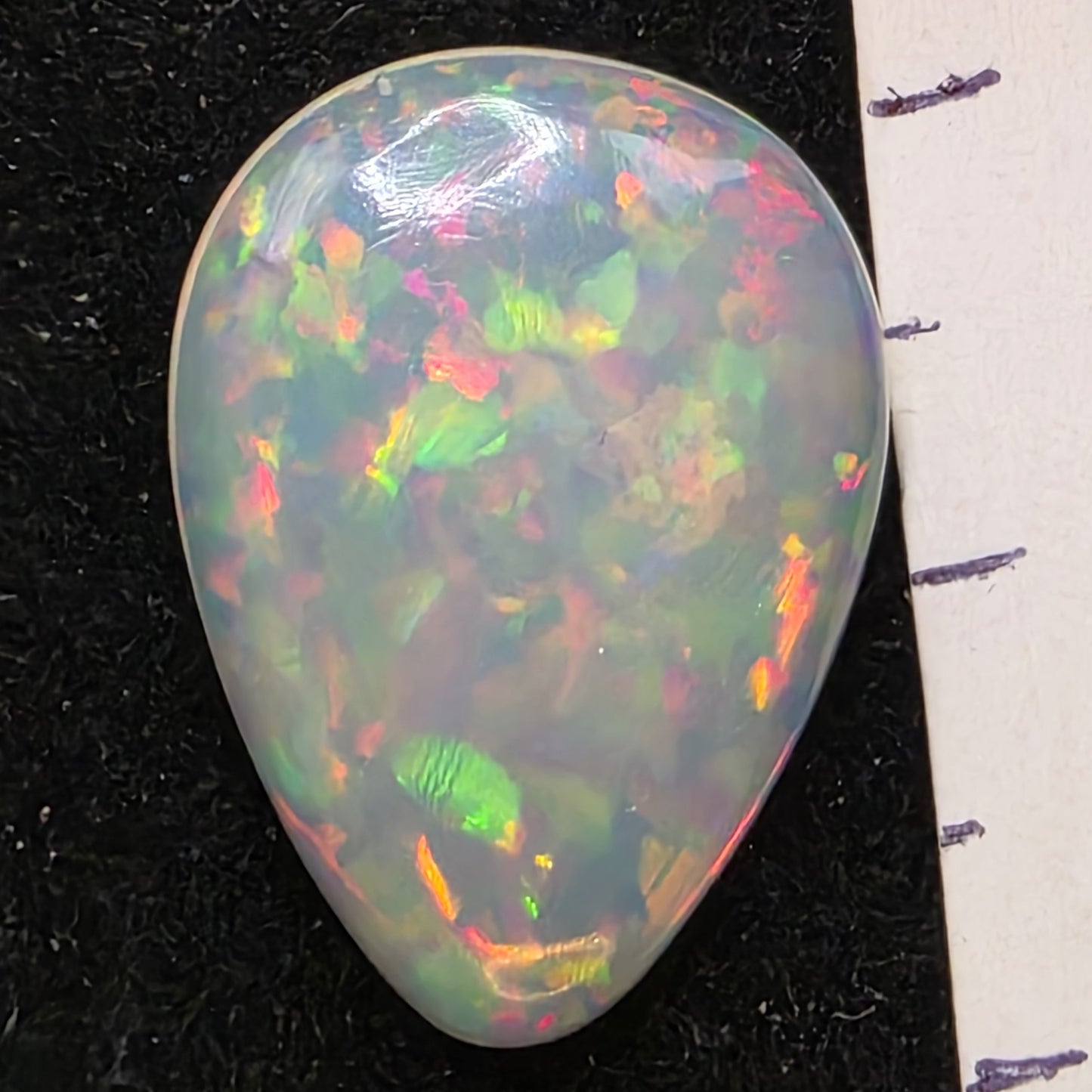 White Opal special Ethiopian Welo, 6.2 ct pear polished, natural, intense Play-of-Colour