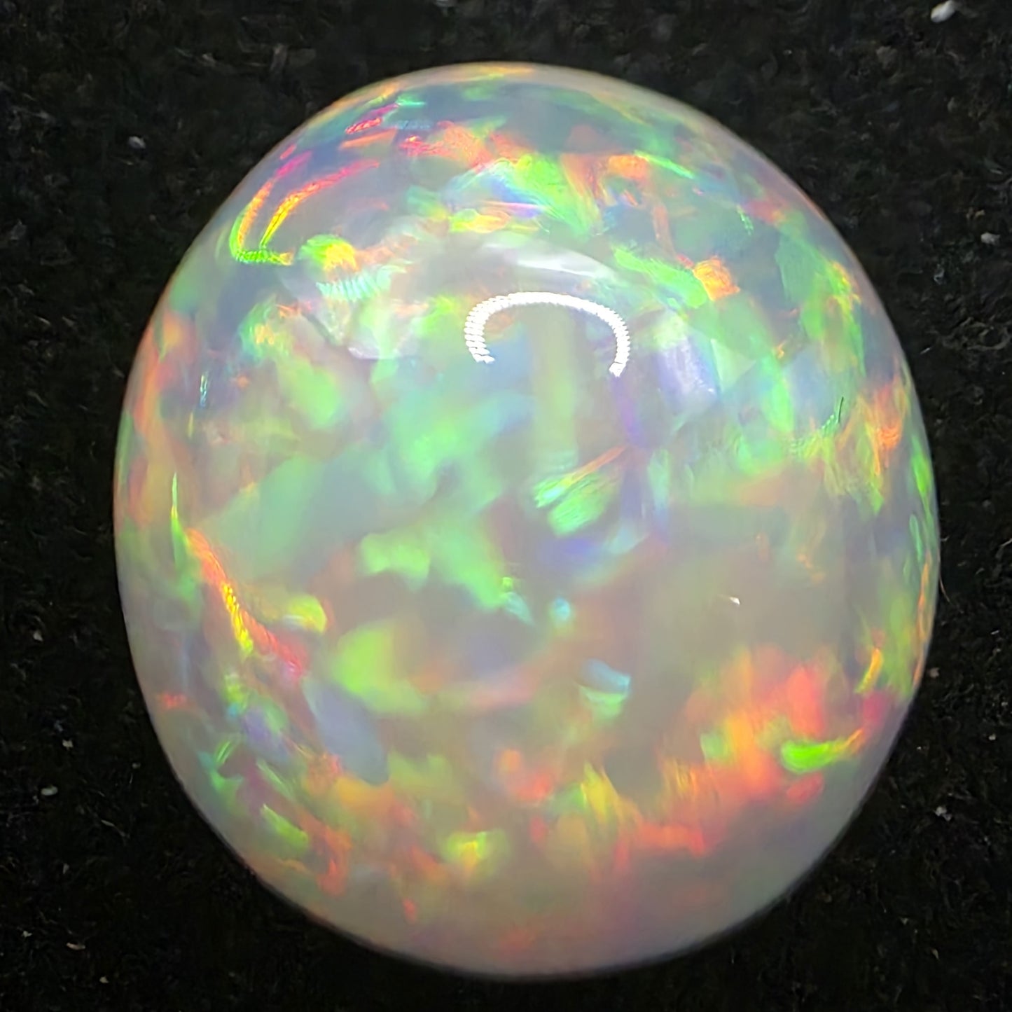 White Opal special Ethiopian Welo, 11.2 ct round polished, natural, intense Play-of-Colour