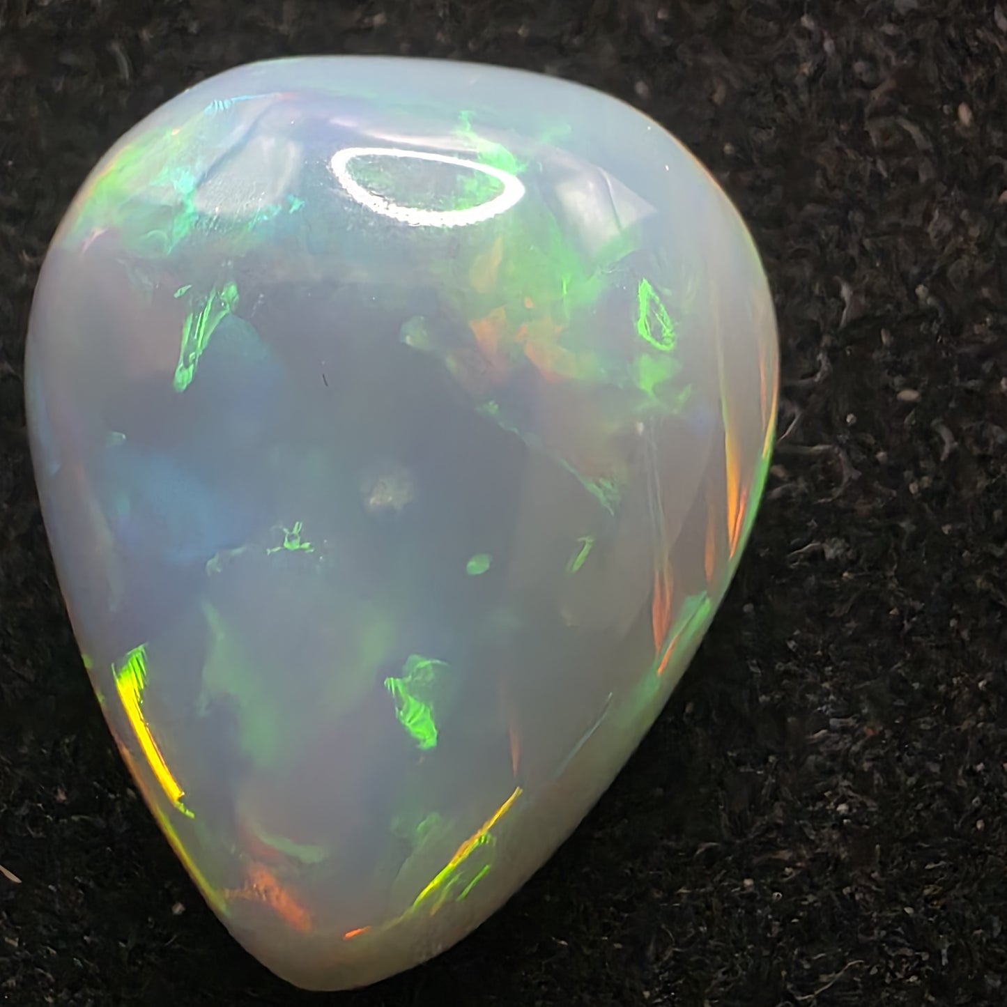 Artsy Black Opal special Ethiopian Welo, 13.85 ct pear polished, natural, intense Play-of-Colour