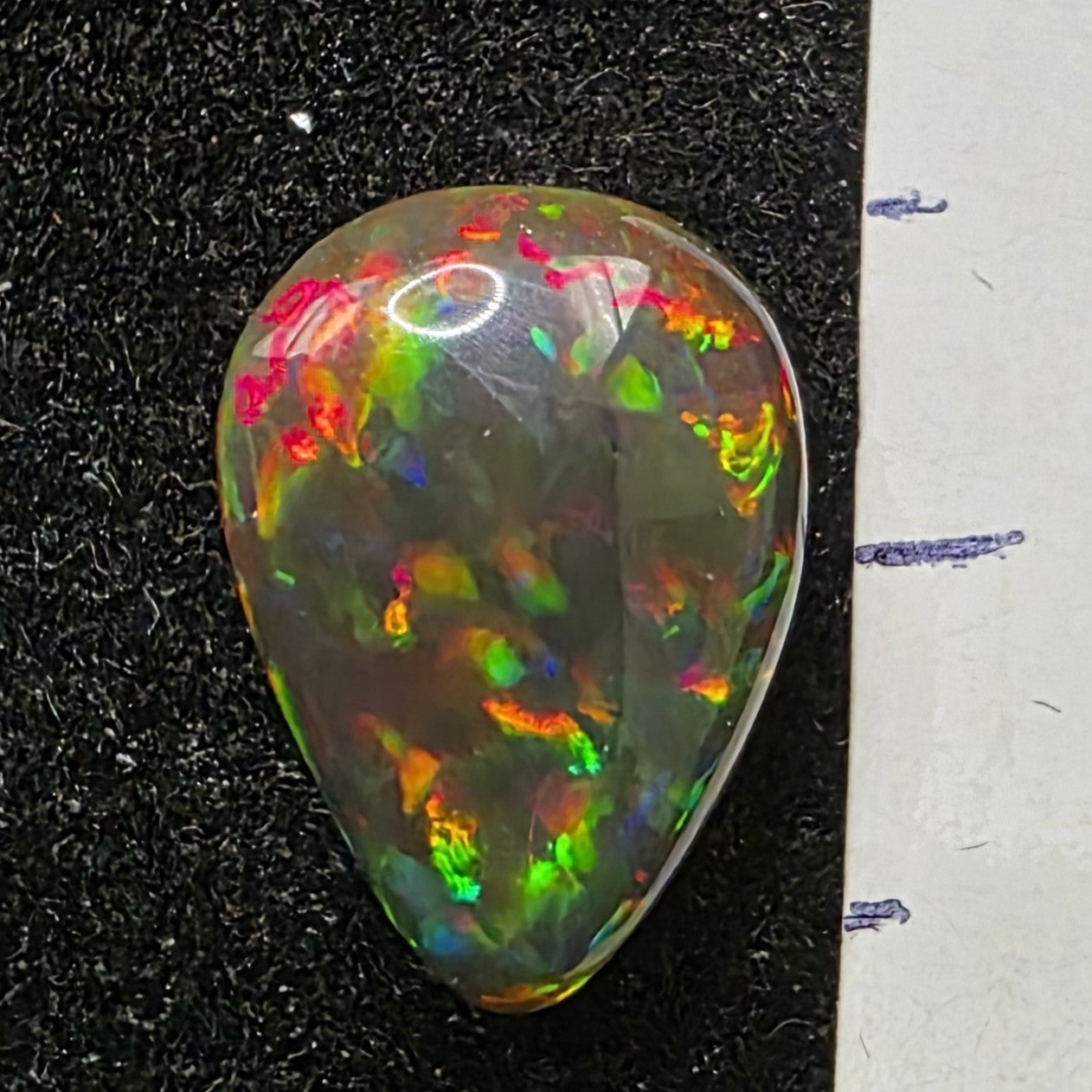 Black Opal special Ethiopian Welo, 2.2 ct pear polished, natural, intense Play-of-Colour