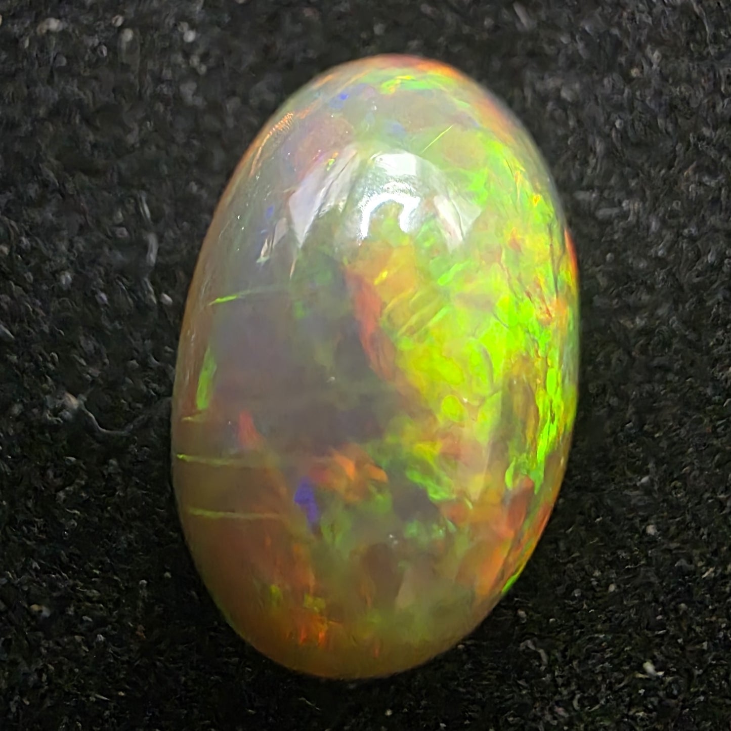 Black Opal special Ethiopian Welo, 6.45 ct oval polished, natural, intense Play-of-Colour