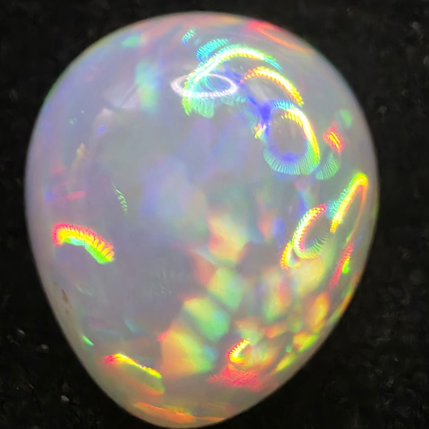 White Opal special Ethiopian Welo, 8.4 ct pear polished, natural, intense Play-of-Colour