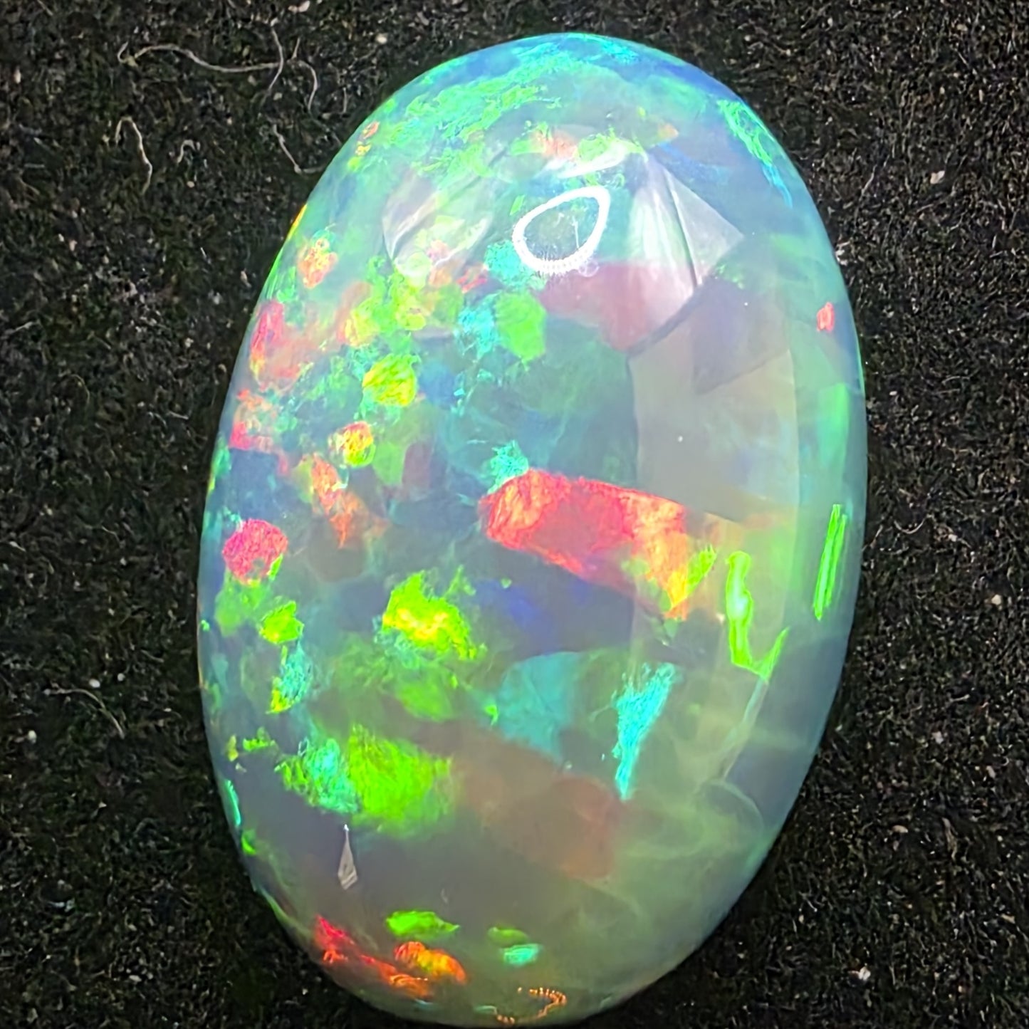 Honeycomb Black Opal special Ethiopian Welo, 8.05 ct oval polished, natural, intense Play-of-Colour