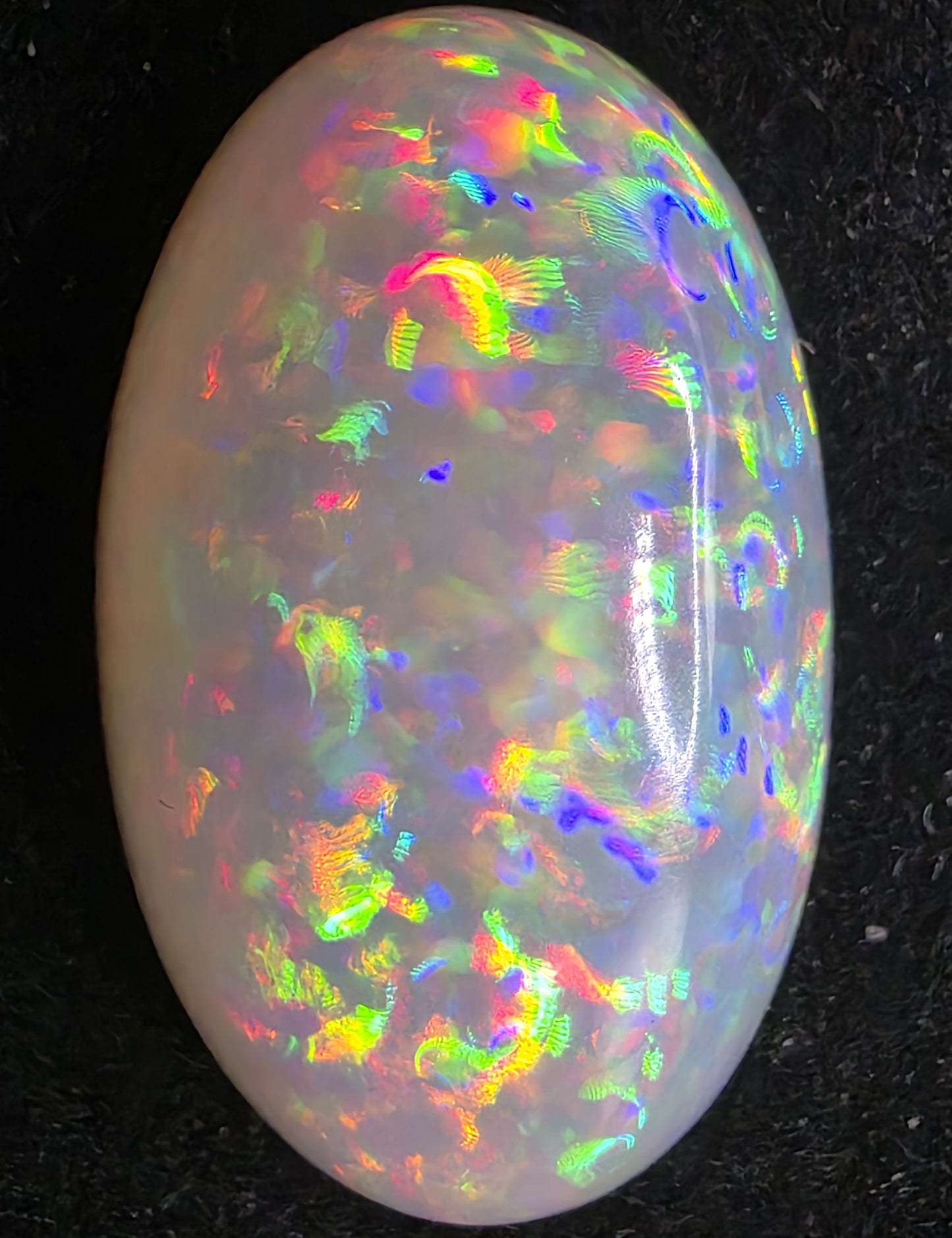 White Opal special Ethiopian Welo, 21 ct oval polished, natural, intense Play-of-Colour