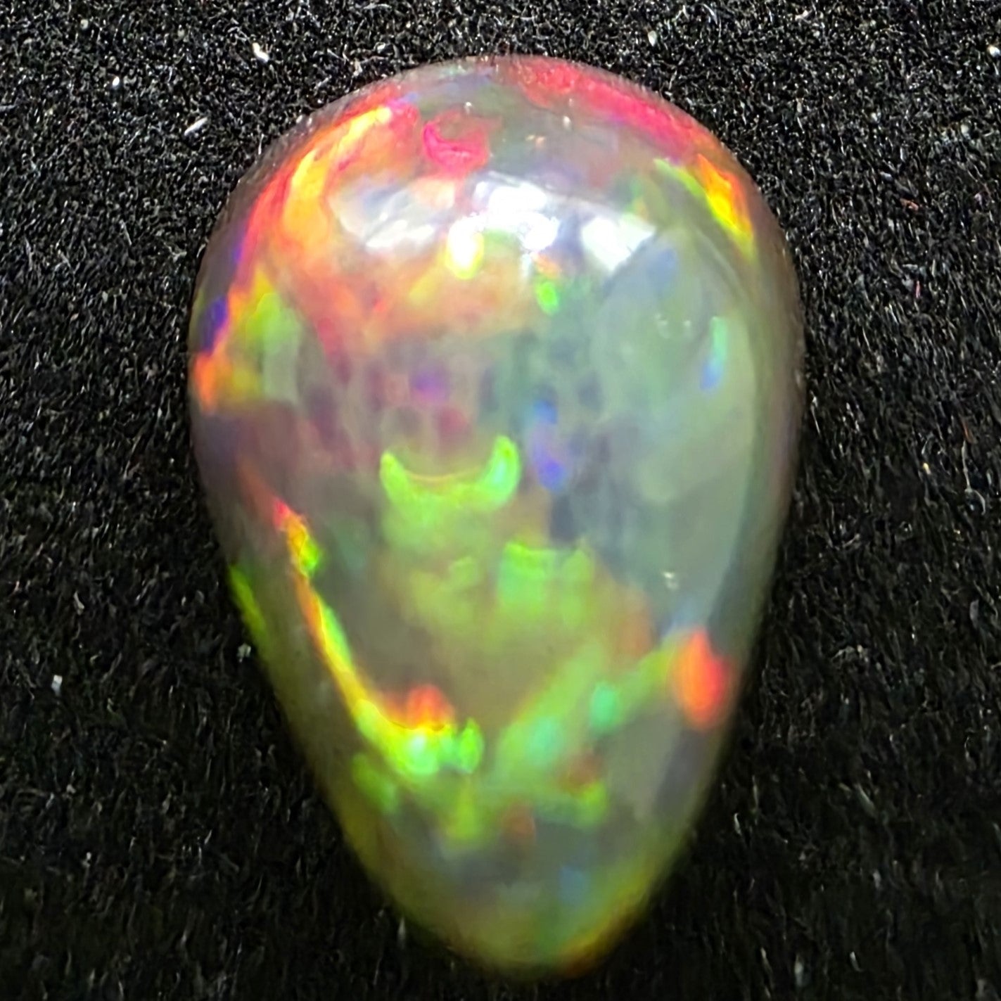 Black Opal special Ethiopian Welo, 5 ct pear polished, natural, intense Play-of-Colour