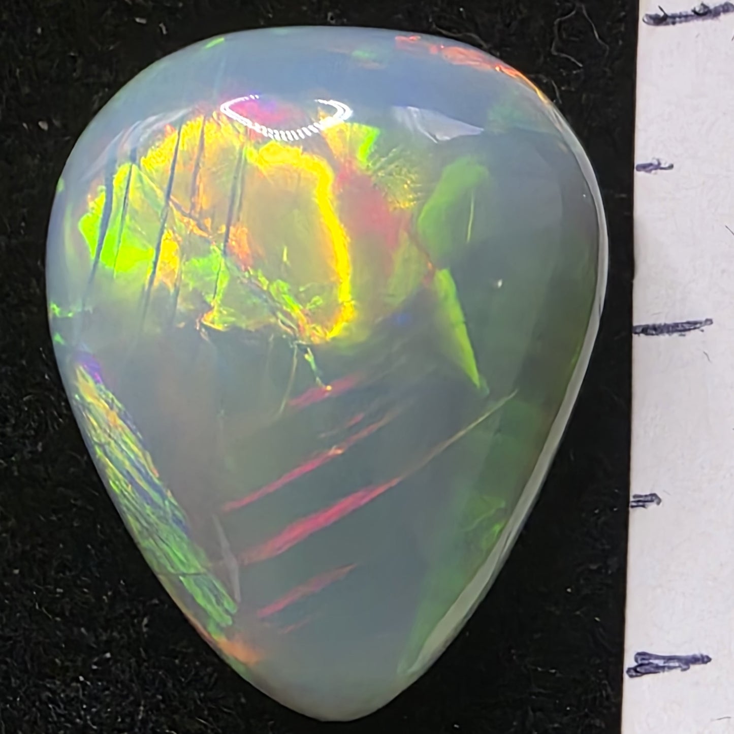 Artsy Black Opal special Ethiopian Welo, 13.85 ct pear polished, natural, intense Play-of-Colour