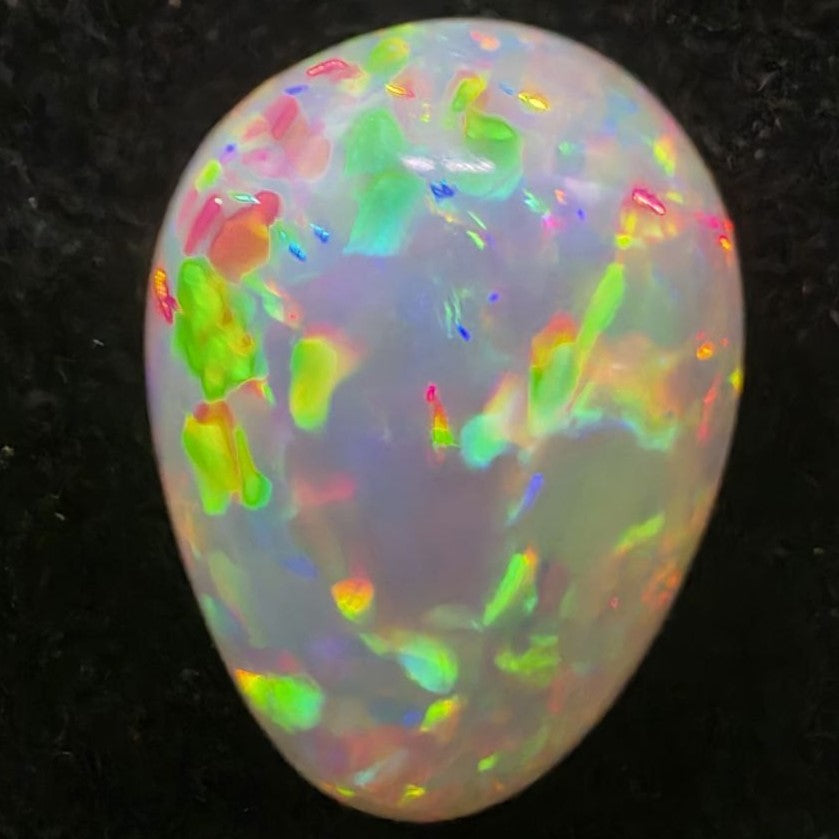 Black Opal special Ethiopian Welo, 4.25 ct pear polished, natural, intense Play-of-Colour