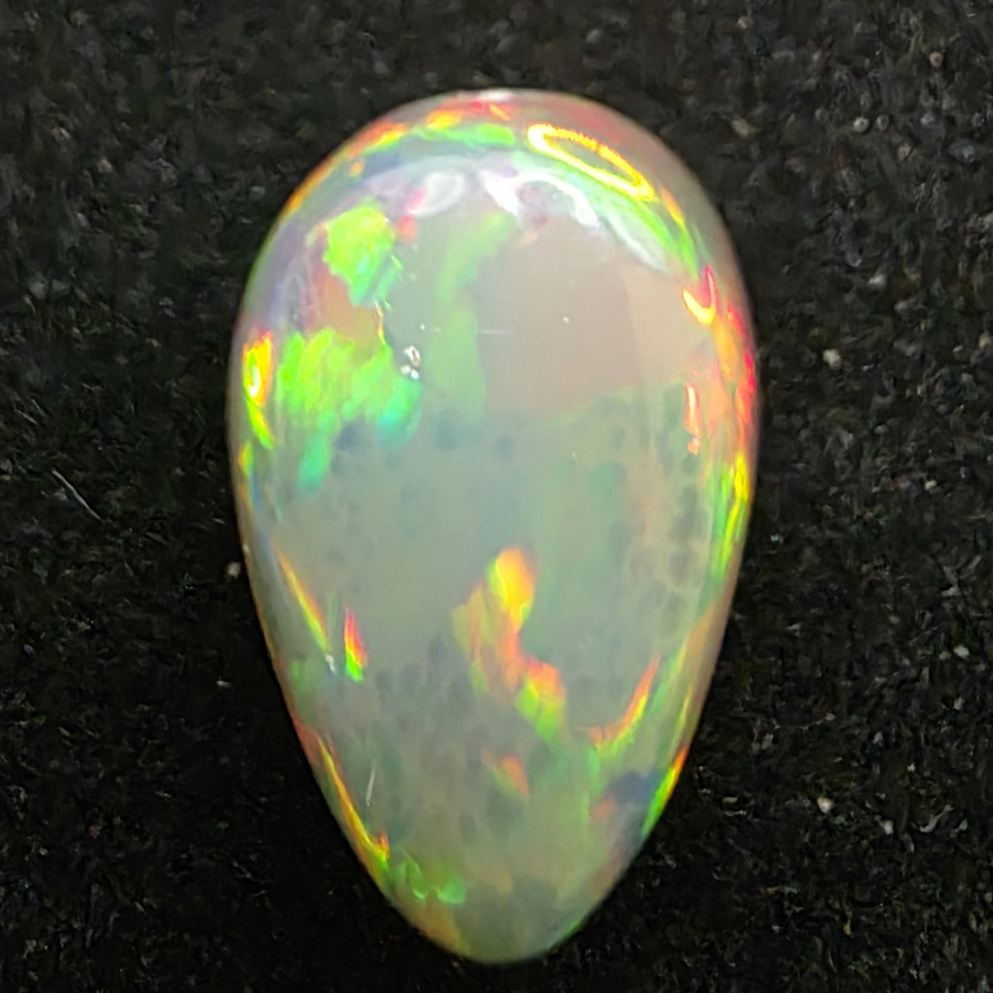 Black Opal special Ethiopian Welo, 4.1 ct pear polished, natural, intense Play-of-Colour