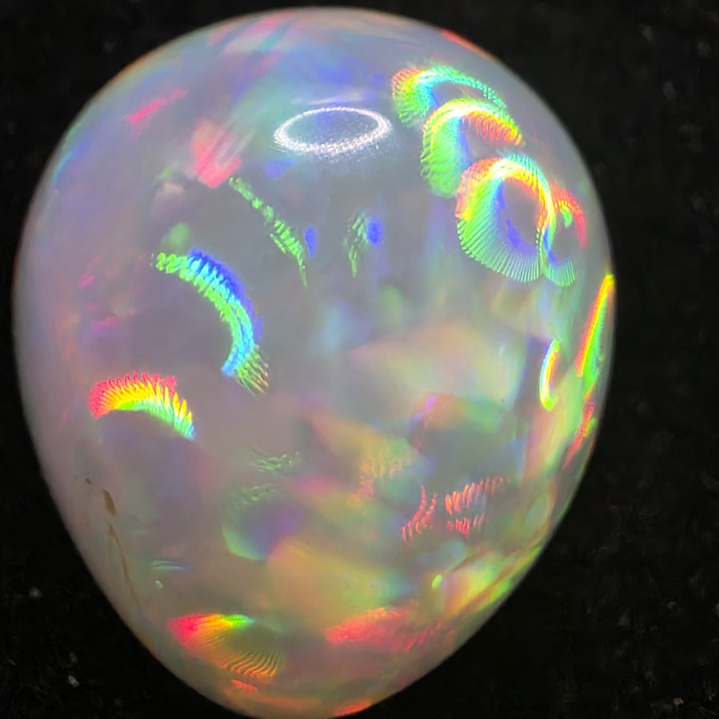 White Opal special Ethiopian Welo, 8.4 ct pear polished, natural, intense Play-of-Colour