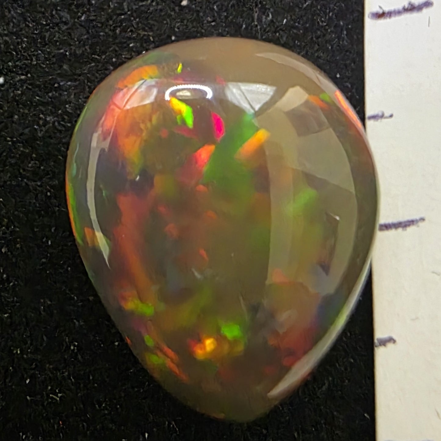 Black Opal special Ethiopian Welo, 7.2 ct pear polished, natural, intense Play-of-Colour