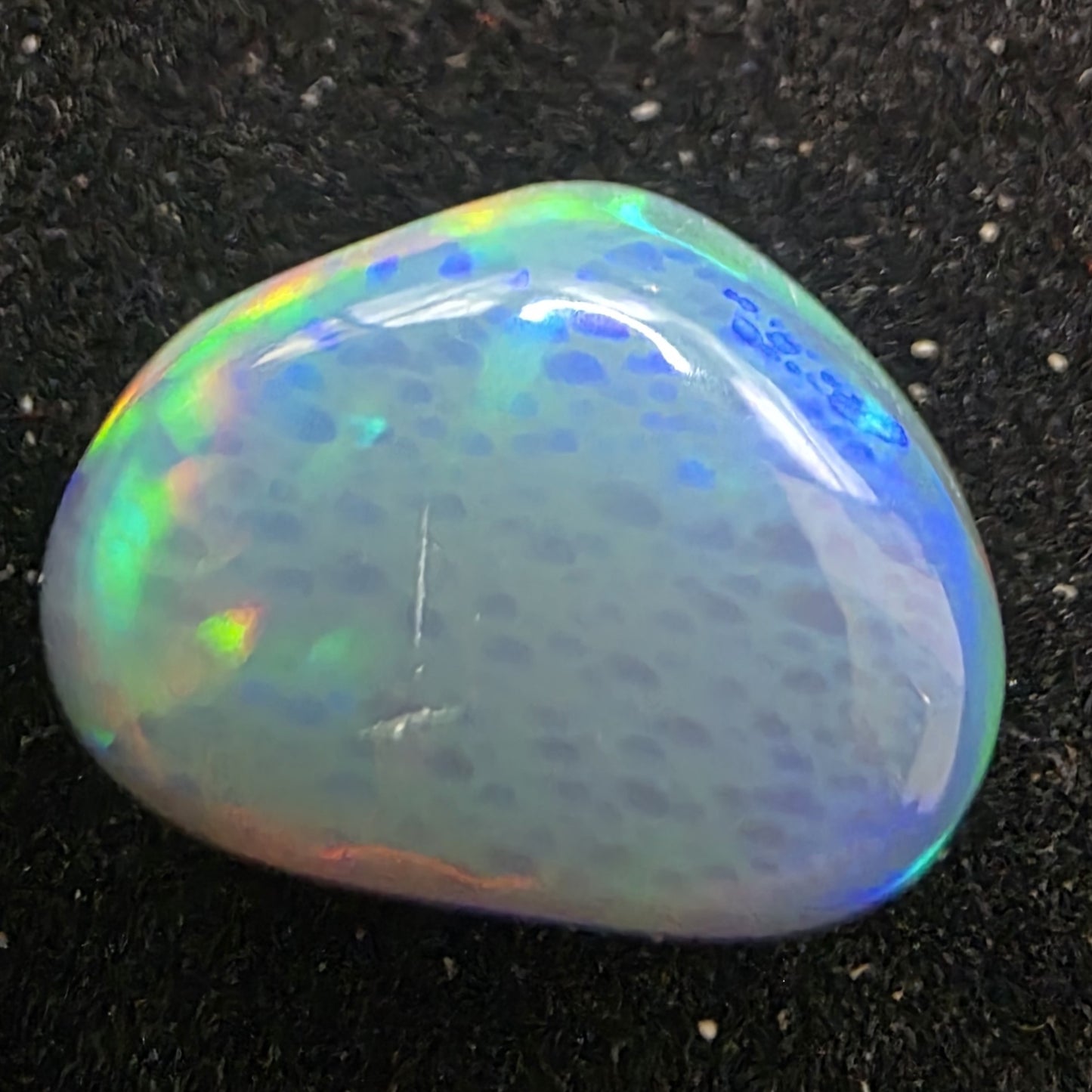 Black Opal special Ethiopian Welo, 4.25 ct freeform polished, natural, intense Play-of-Colour