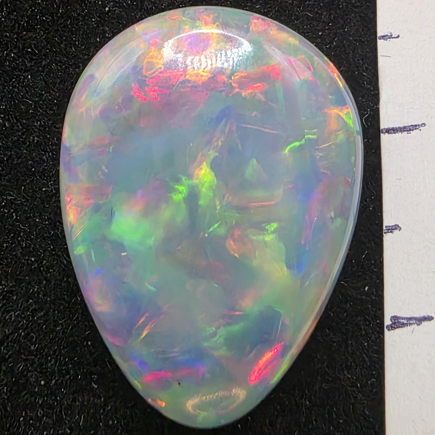 White Opal special Ethiopian Welo, 11 ct pear polished, natural, intense Play-of-Colour