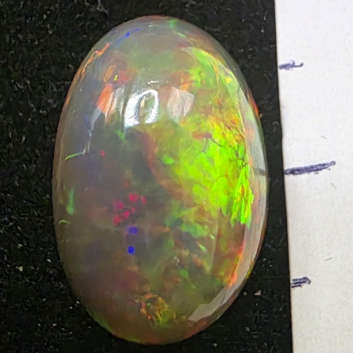 Black Opal special Ethiopian Welo, 6.45 ct oval polished, natural, intense Play-of-Colour