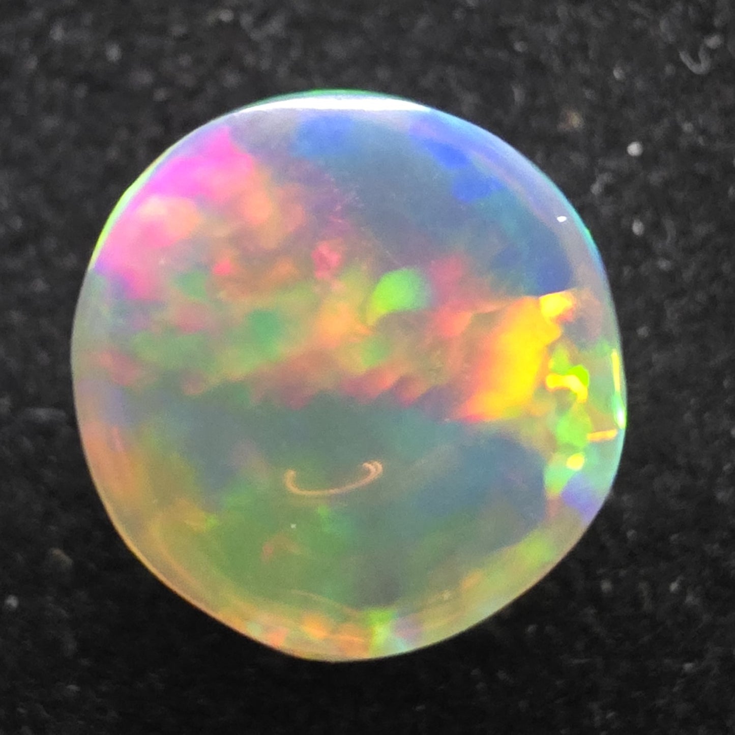 Crystal Opal special Ethiopian Welo, 5.6 ct round polished, natural, intense Play-of-Colour