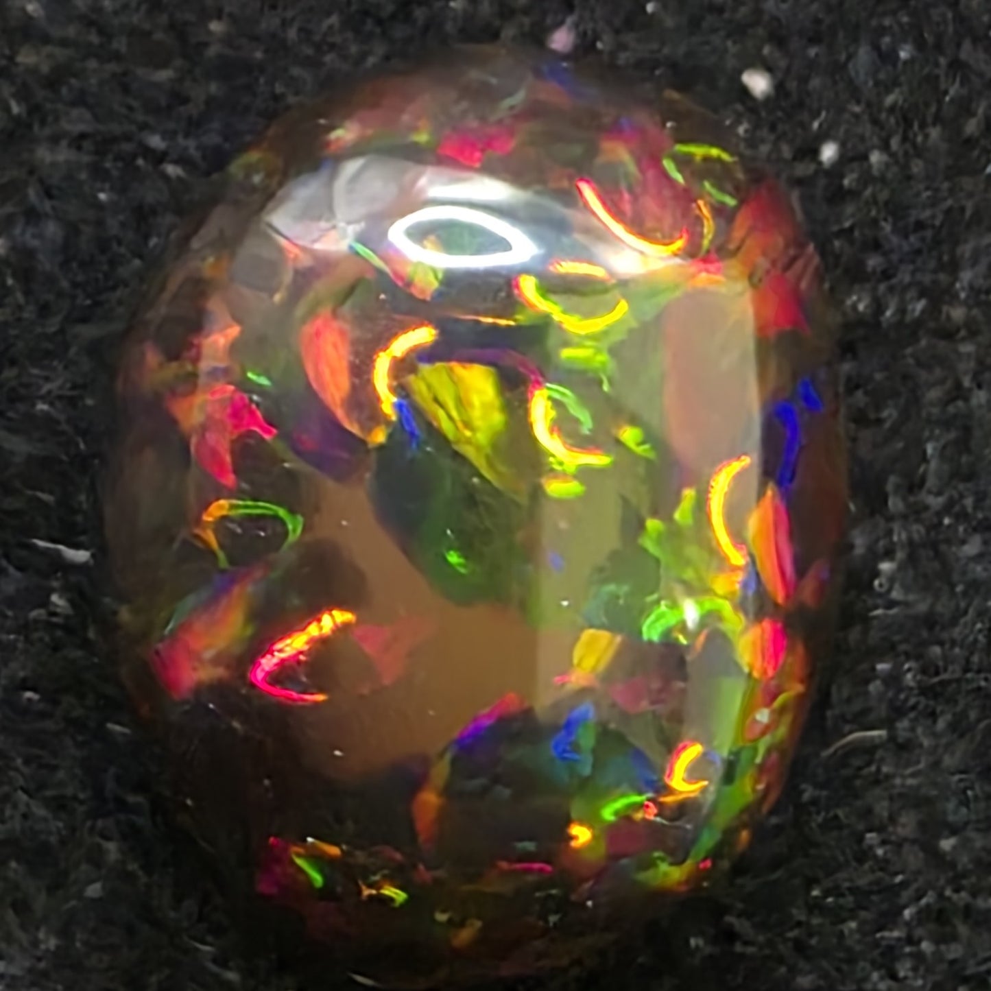 Black Opal special Ethiopian Welo, 4.6 ct oval polished, natural, intense Play-of-Colour