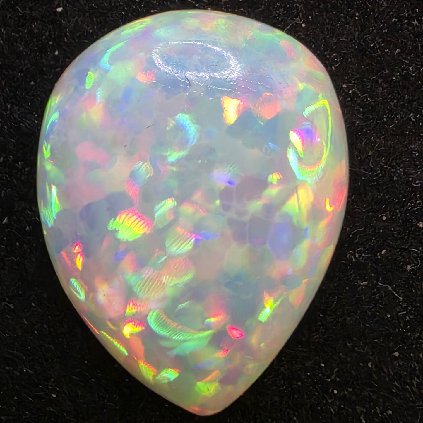 White Opal special Ethiopian Welo, 5.5 ct pear polished, natural, intense Play-of-Colour