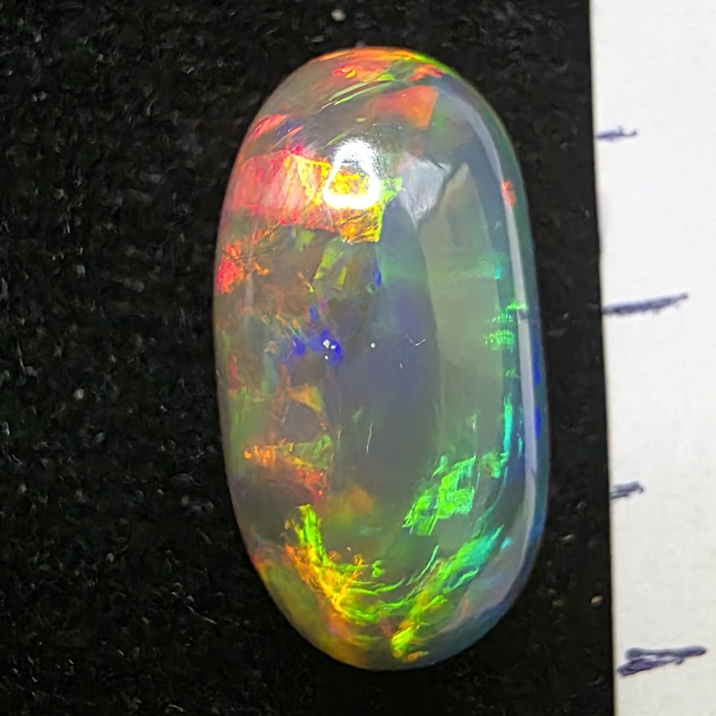 Black Opal special Ethiopian Welo, 5.4 ct oval polished, natural, intense Play-of-Colour