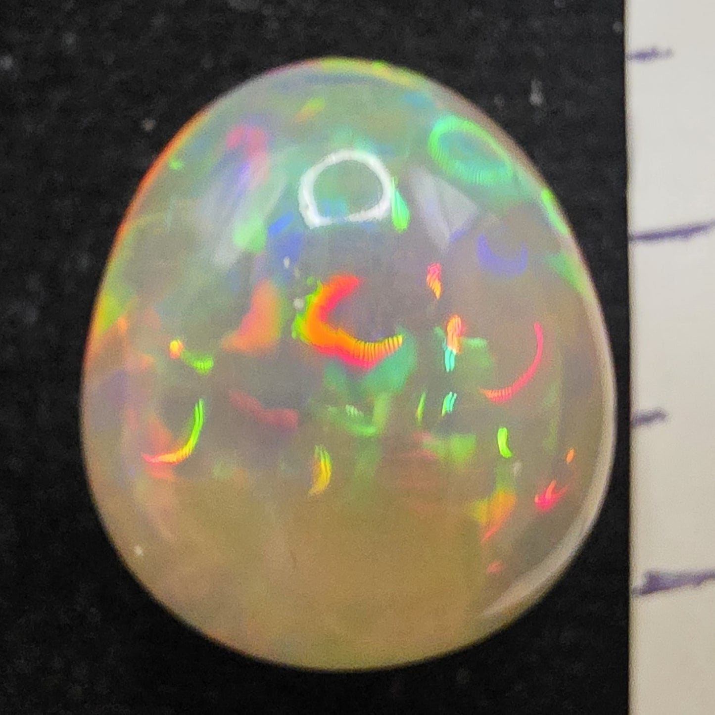 White Opal special Ethiopian Welo, 9.3 ct pear polished, natural, intense Play-of-Colour