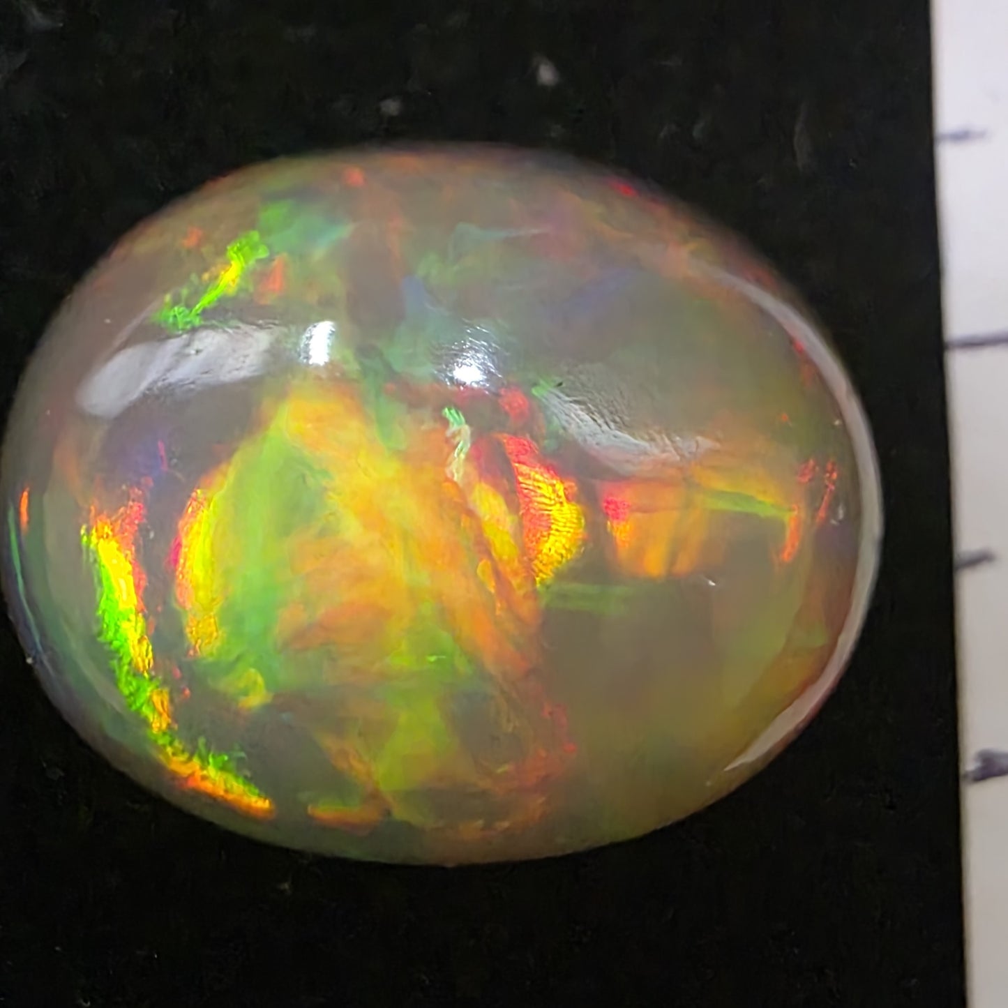 Black Opal special Ethiopian Welo, 21.2 ct oval polished, natural, intense Play-of-Colour